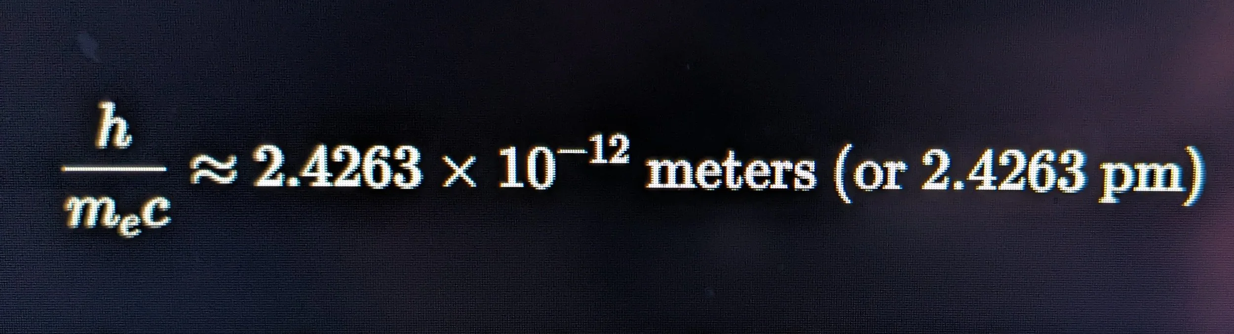 Scientific formula showing the calculation of the Planck constant divided by the product of certain parameters, with an approximation to 2.4263 times 10 to the negative 12 meters or 2.4263 picometers.