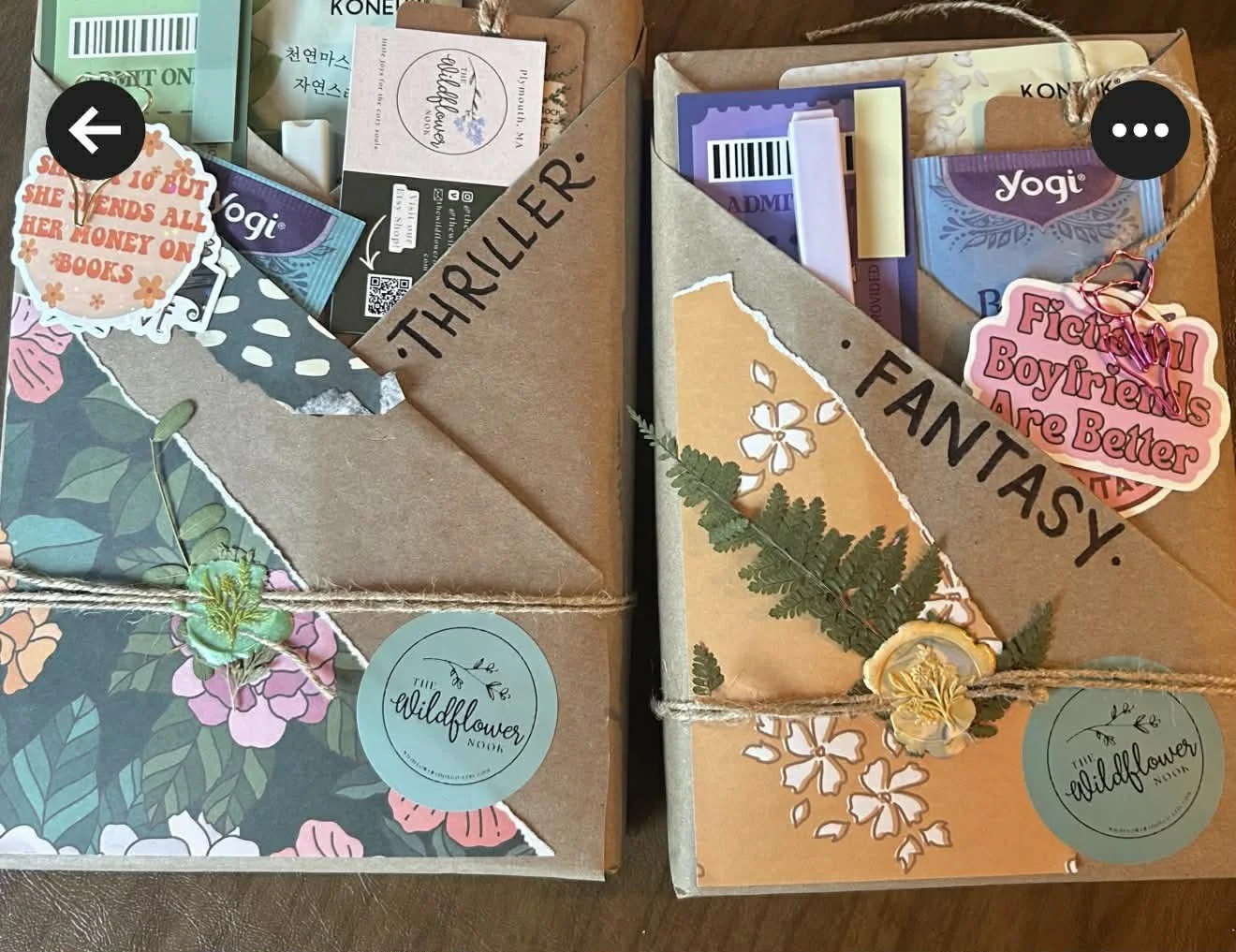 Two gift boxes wrapped in brown paper with floral and botanical designs, labeled 'Thriller' and 'FantasY.' The boxes are decorated with stickers, tags, and dried flowers, and tied with twine.