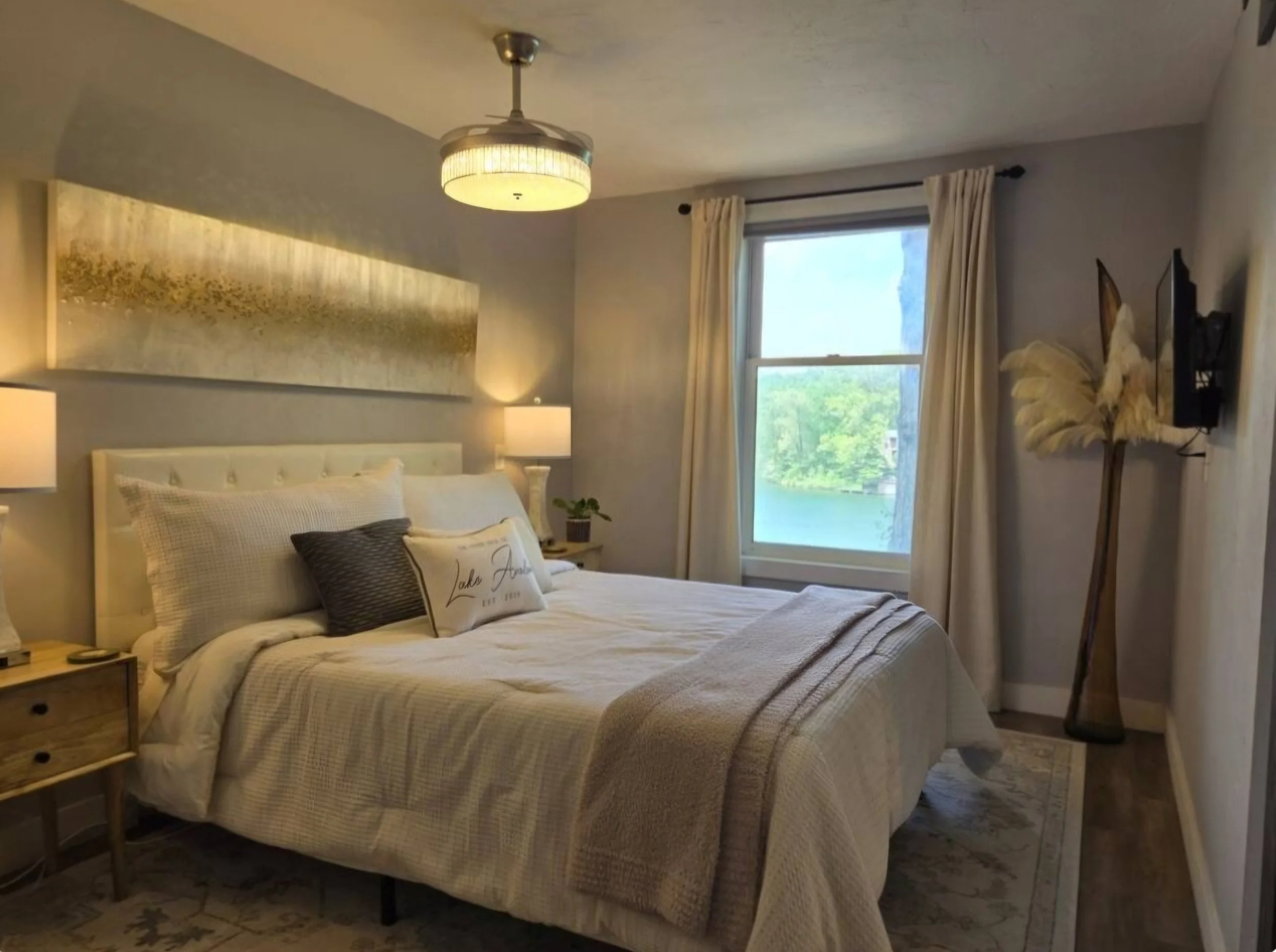 A quiet room for slow mornings and restful nights. Cozy bedroom at The Green Door on Lake Avalon with soft lighting and lake view.