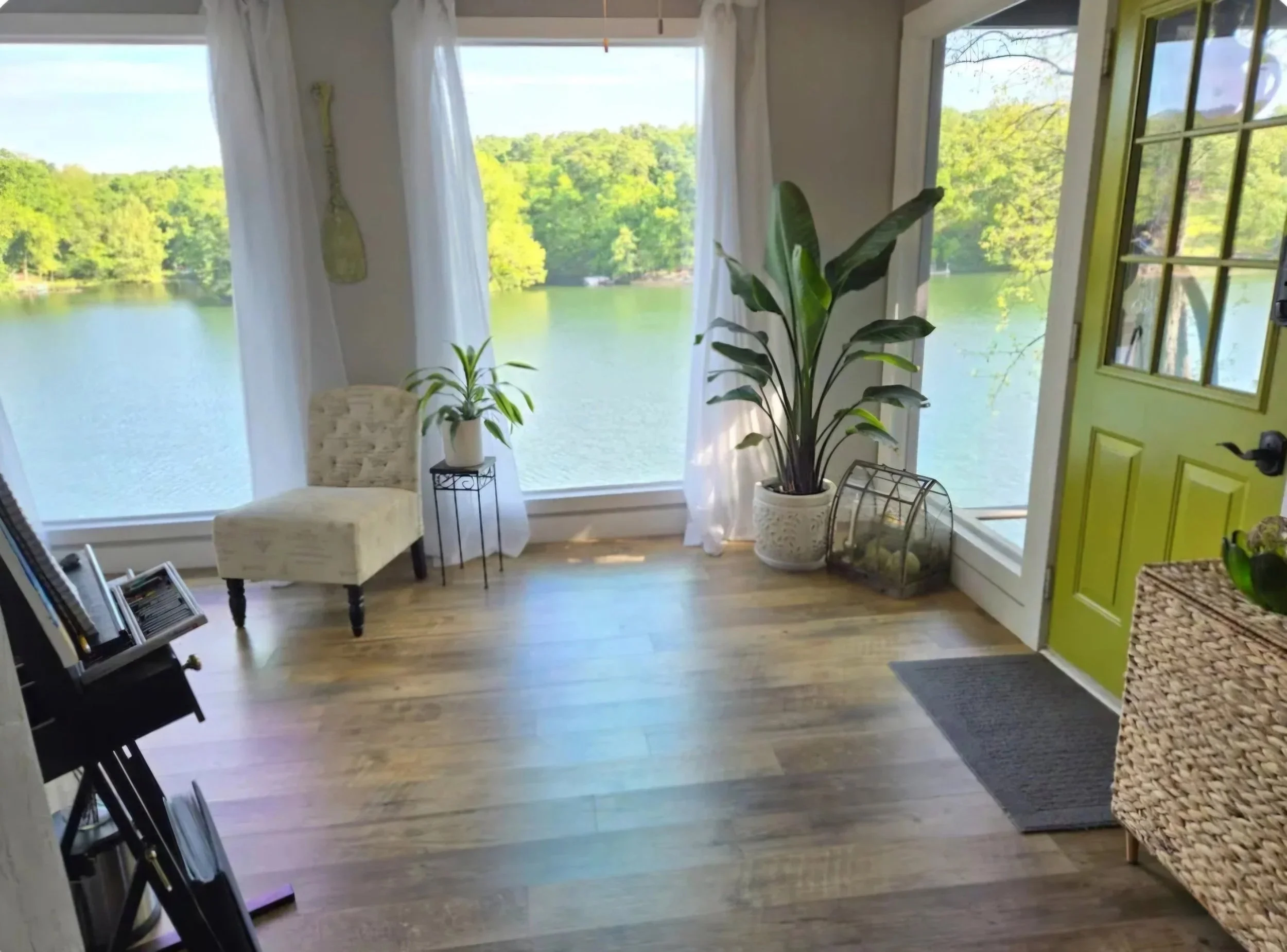 Light, lake views, and a quiet place to arrive. Bright interior at The Green Door on Lake Avalon with lake views and the green entry door.