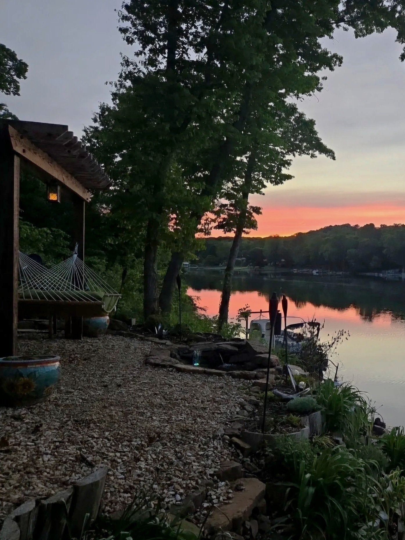 Hammock beside Lake Avalon at sunset at The Green Door lakeside retreat.