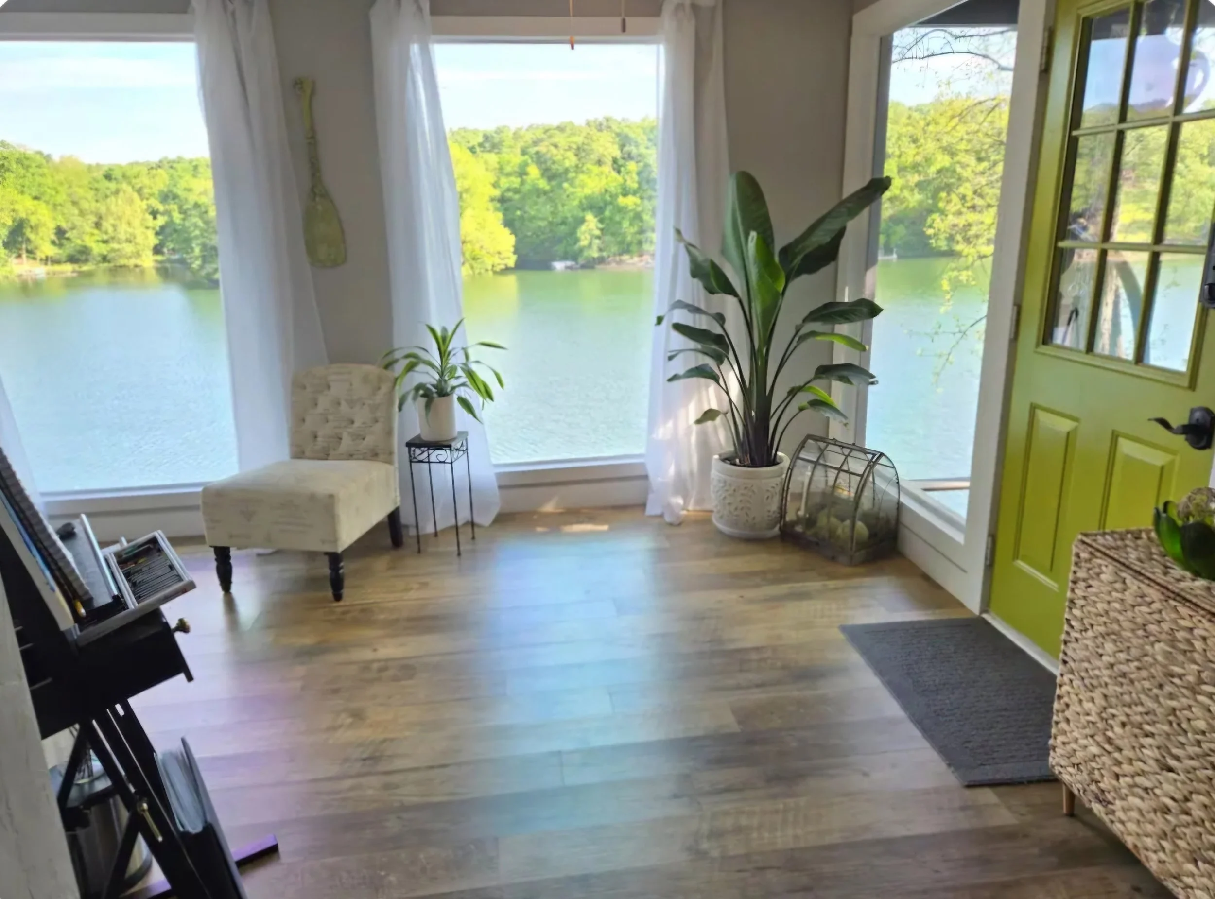 Bright interior at The Green Door on Lake Avalon with lake views, and light. A quiet place to arrive.