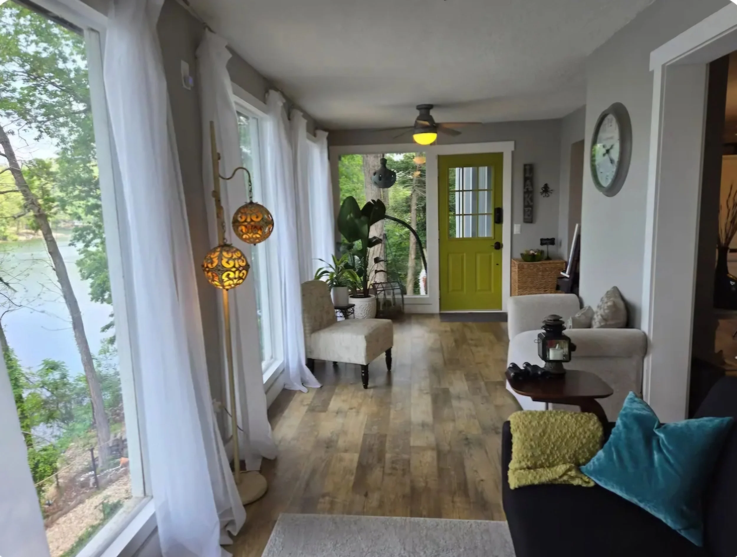 Bright entry room at The Green Door on Lake Avalon, with green door, lake views and cozy seating. A quiet welcome just steps from the lake.