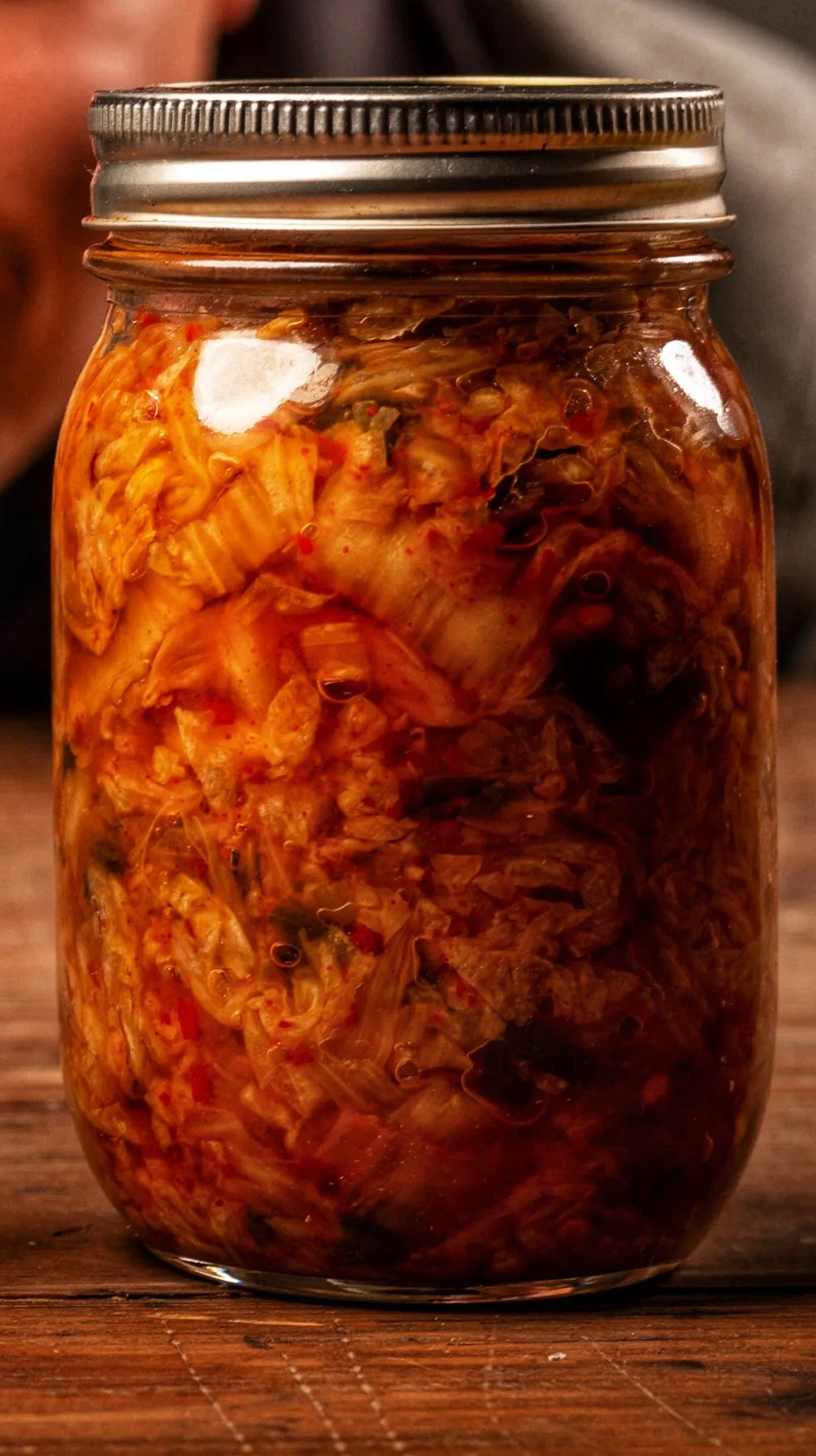Glass jar filled with homemade fermented cabbage