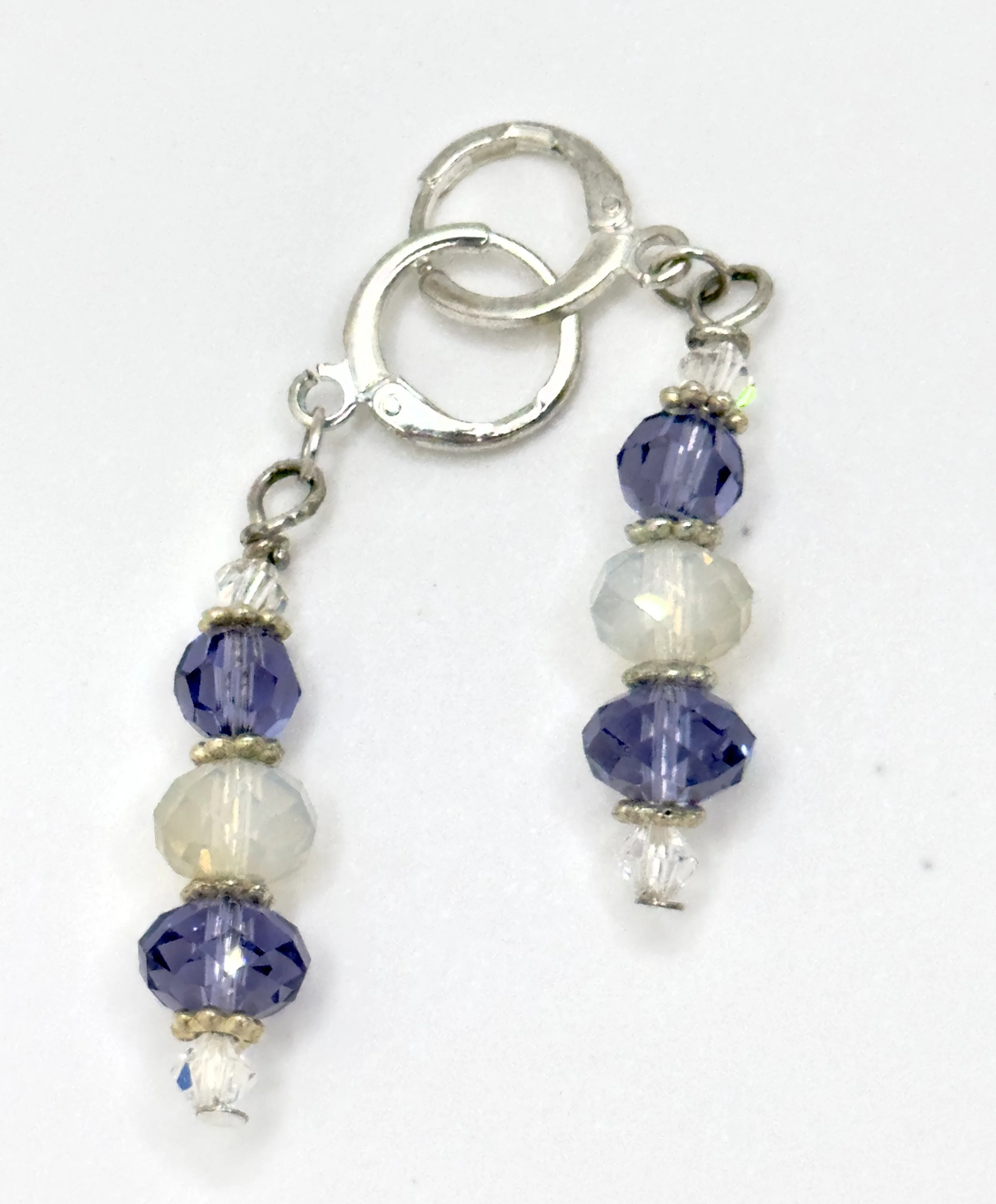 Purple and opaque off white earrings