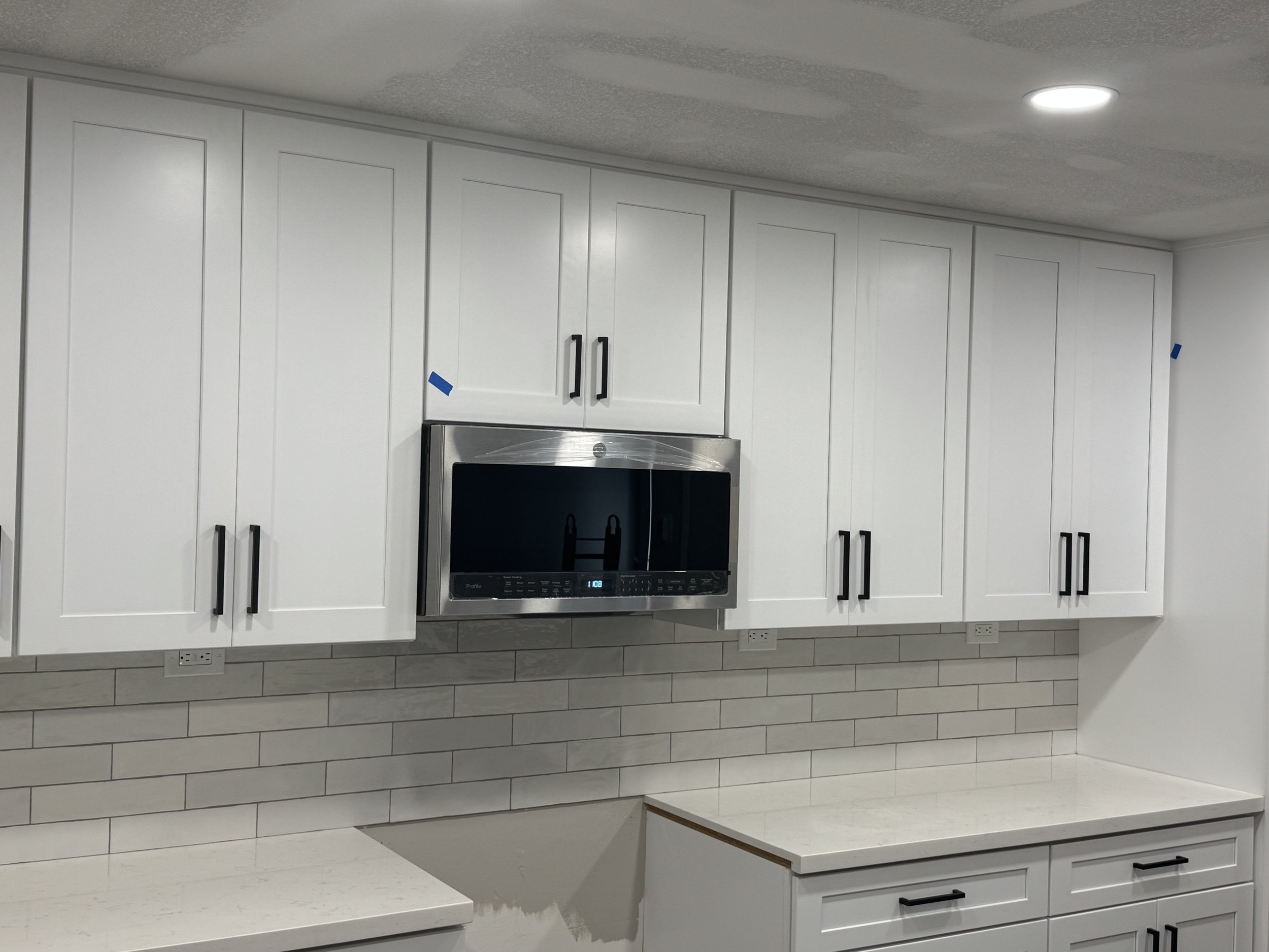 Taller Kitchen cabinet uppers with Oven and Microwave moved to perimeter wall