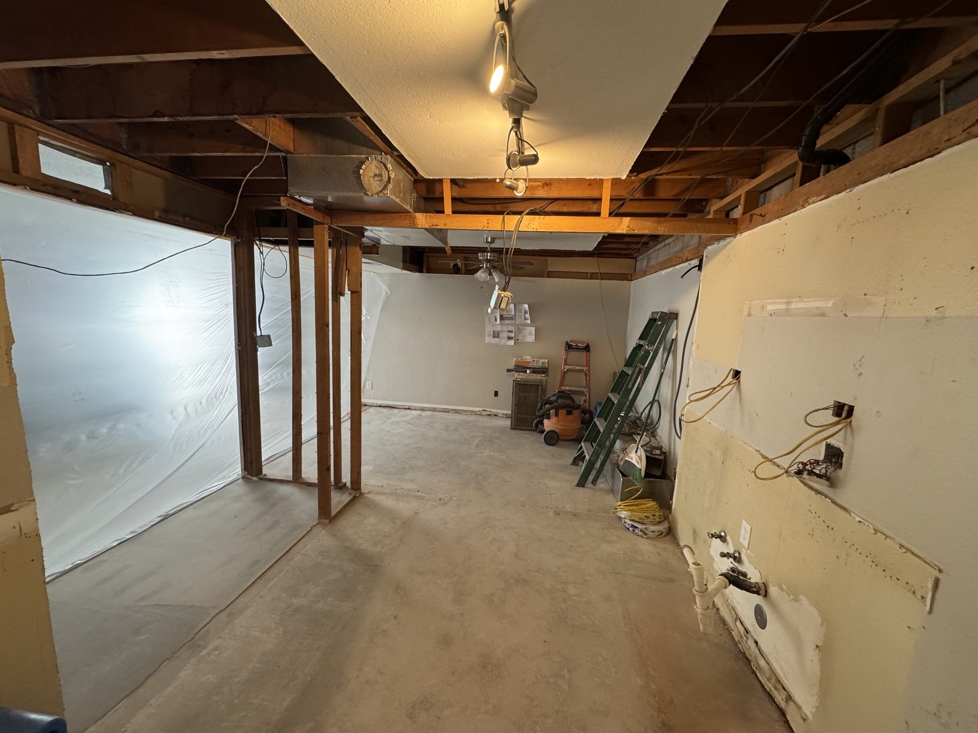 Removing Family Room and Dining Room Walls + DR Soffit- During -view from Laundry Room