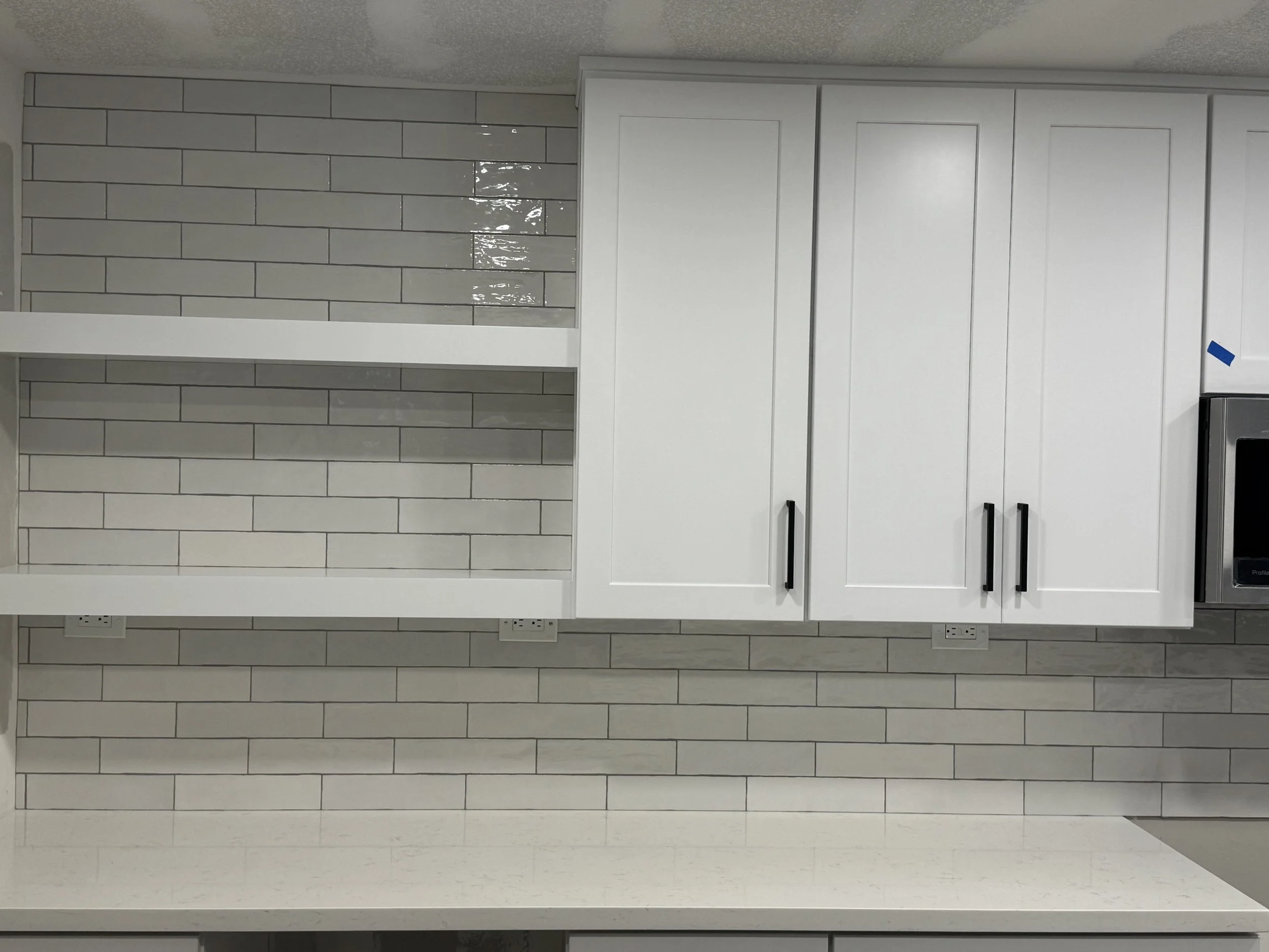 Expanded Kitchen Perimeter Cabinetry with Shelving- replacing original dining room space