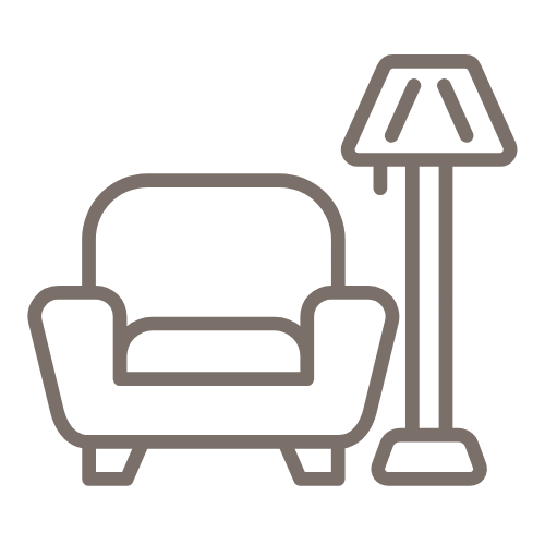 Line art illustration of a sofa with a floor lamp next to it.