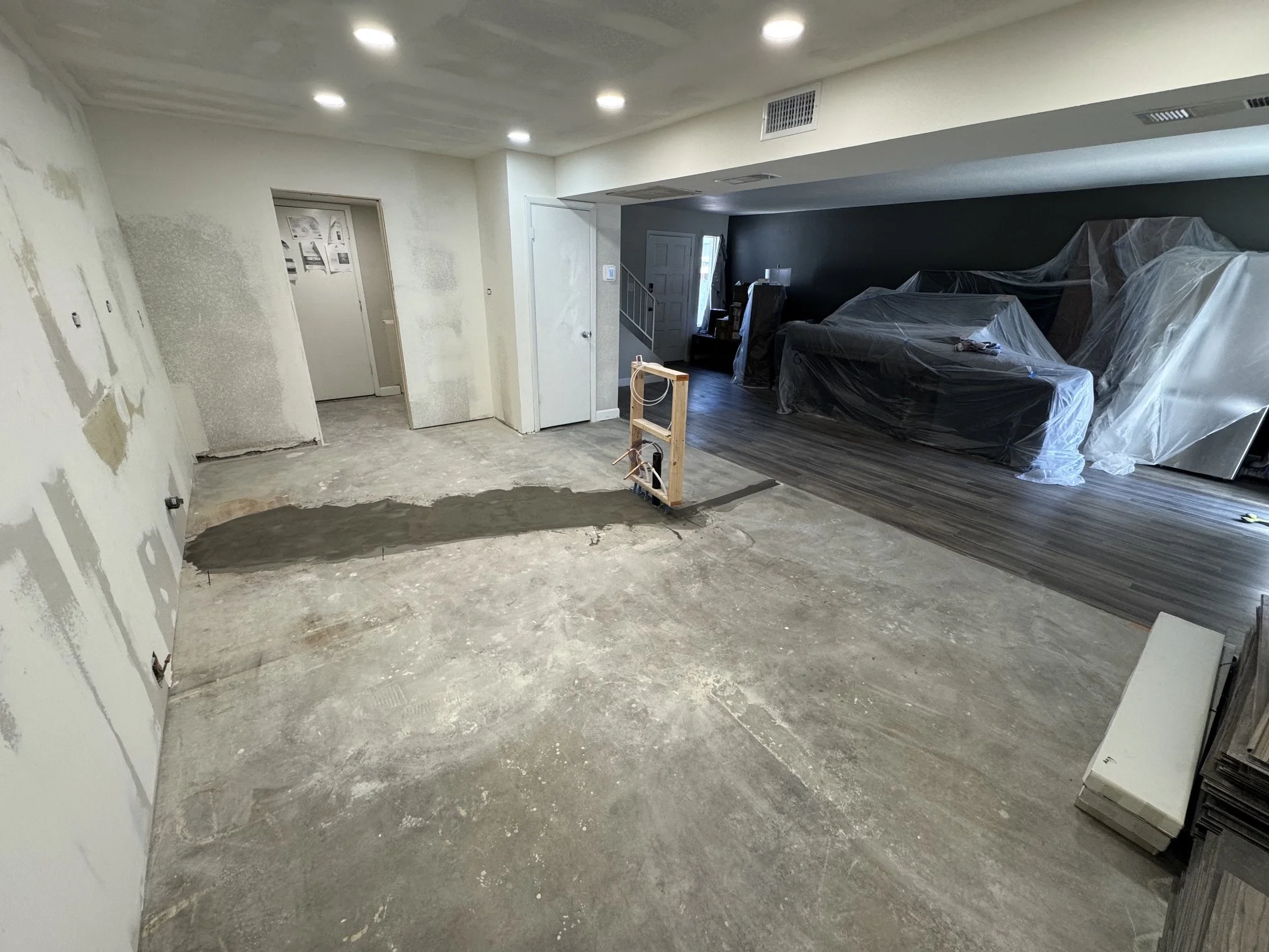 Move plumbing over to kitchen island- During - view from original Dining Room