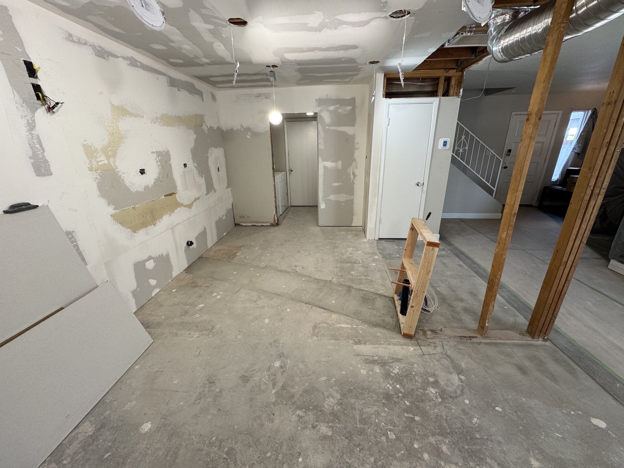 Moving electrical and adding ceiling lights- During -view from original Dining Room