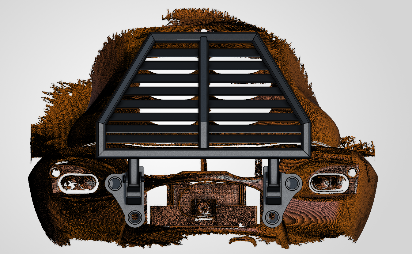 A black plastic grille with horizontal slats mounted in front of a background image of a damaged car with a crushed bumper and missing headlight.