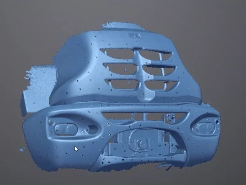 A digital 3D model of a blue motorcycle helmet shell in a CAD rendering program.