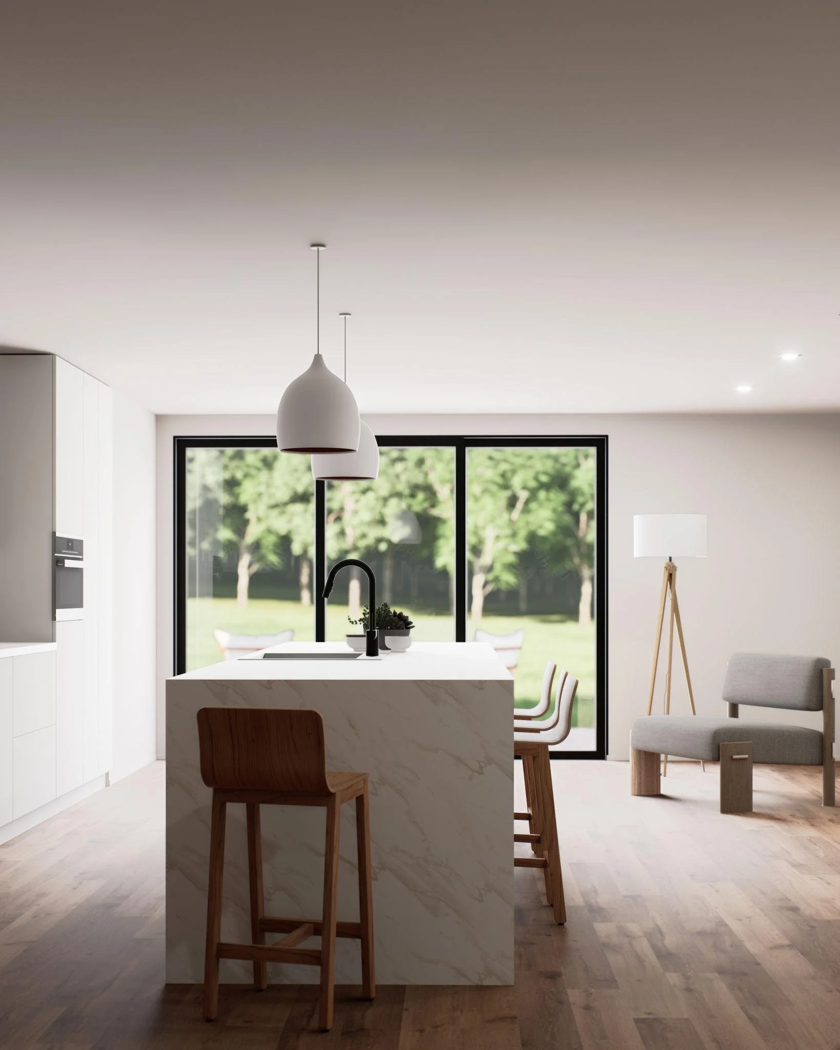 Modern kitchen with a white marble island, black faucet, white cabinetry, large window overlooking trees, three chairs at the island, a floor lamp, and a gray armchair.