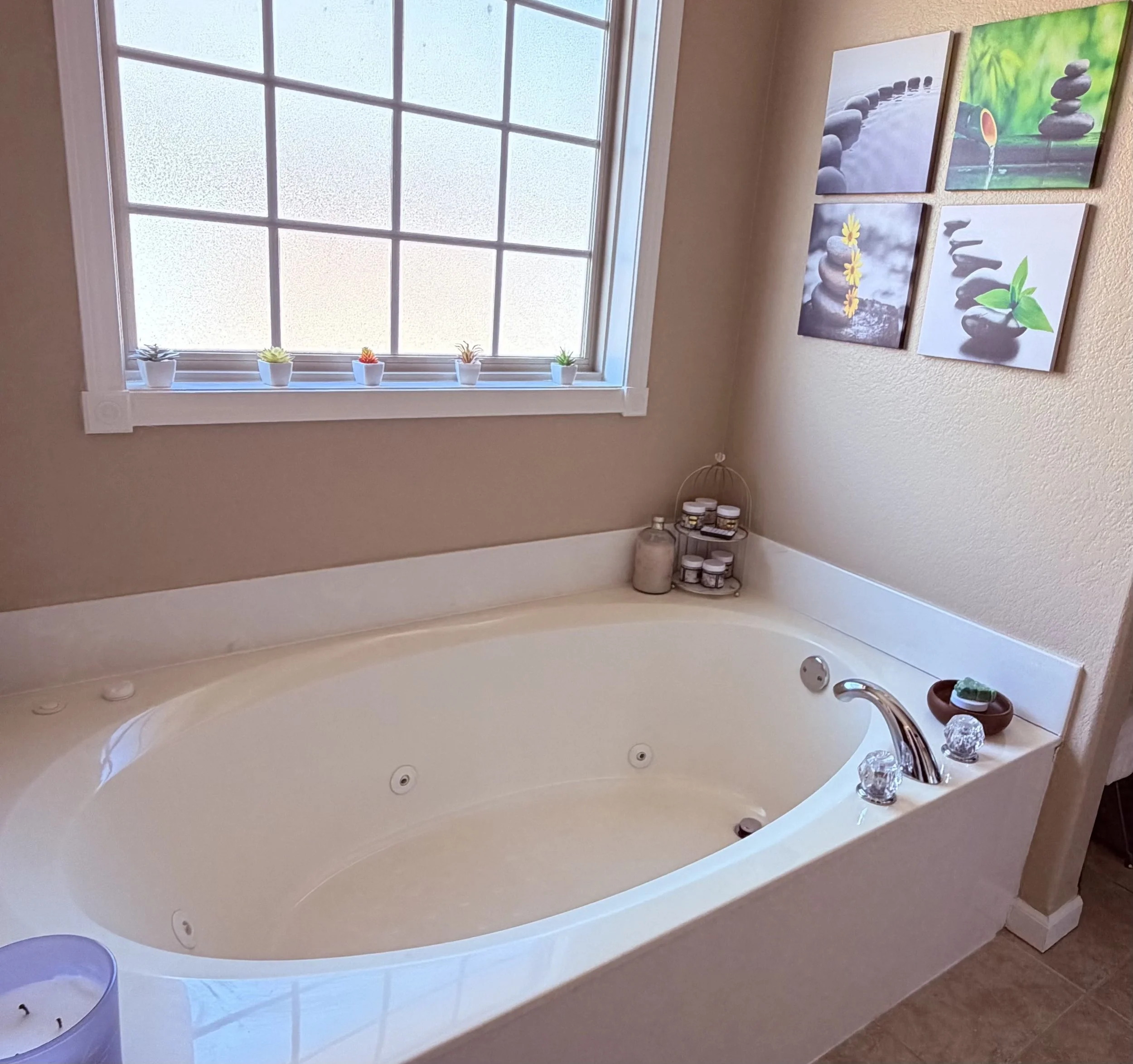 Freshly cleaned jetted bathtub and surrounding bathroom surfaces.