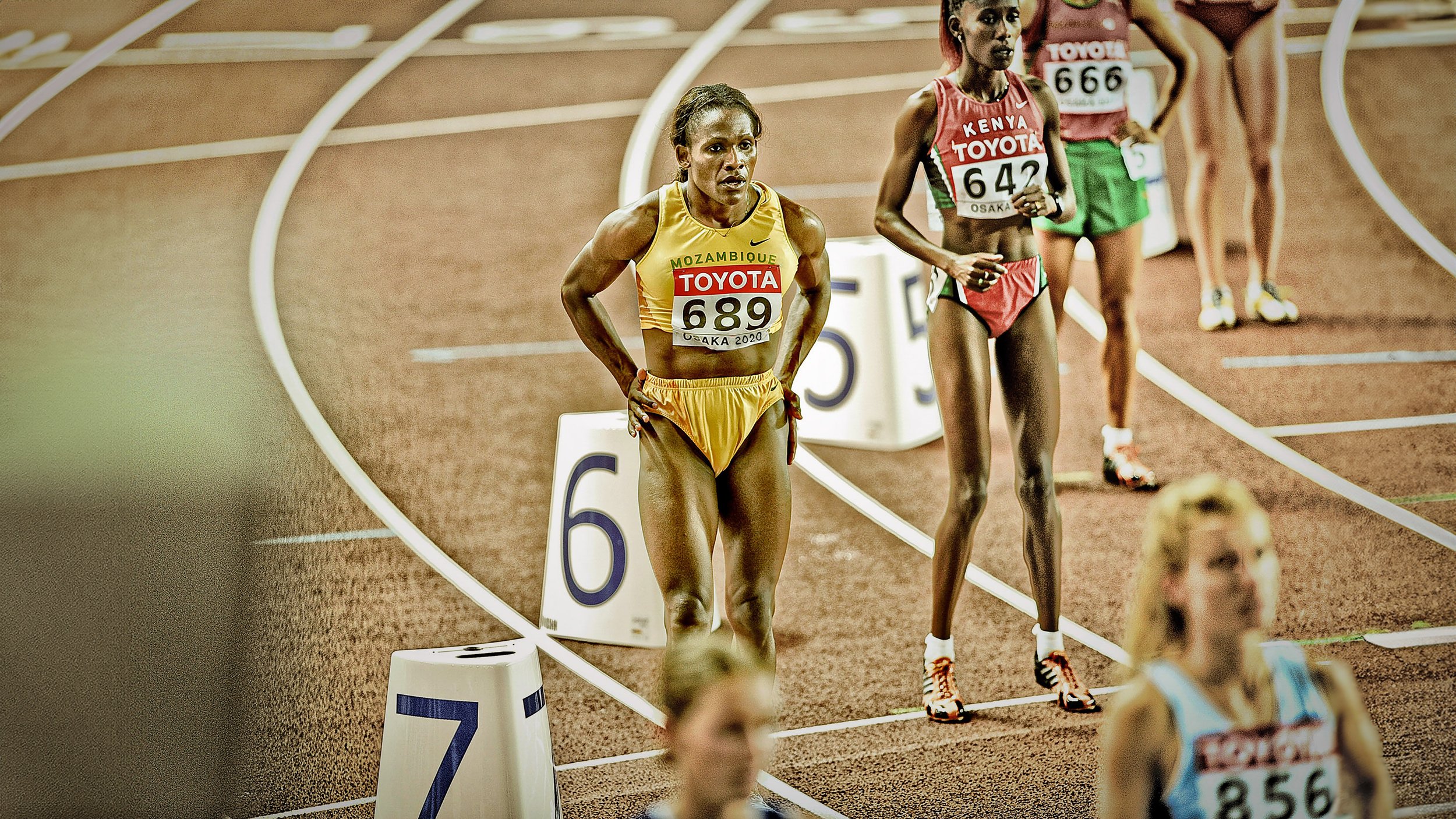 final 2026 stand  osaca gold running Blur copy.jpg