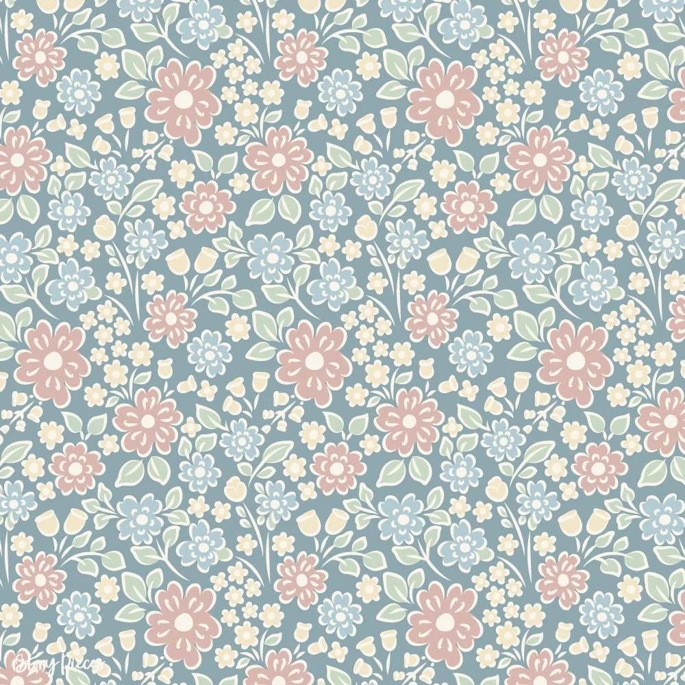 Vintage floral surface pattern with small ditsy flowers in soft pink, blue, and cream on a muted blue background, delicate botanical design.