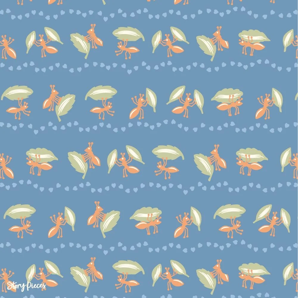 Playful repeat pattern on a soft blue background featuring rows of orange ants carrying green leaves, with dotted heart trails forming gentle lines between them.