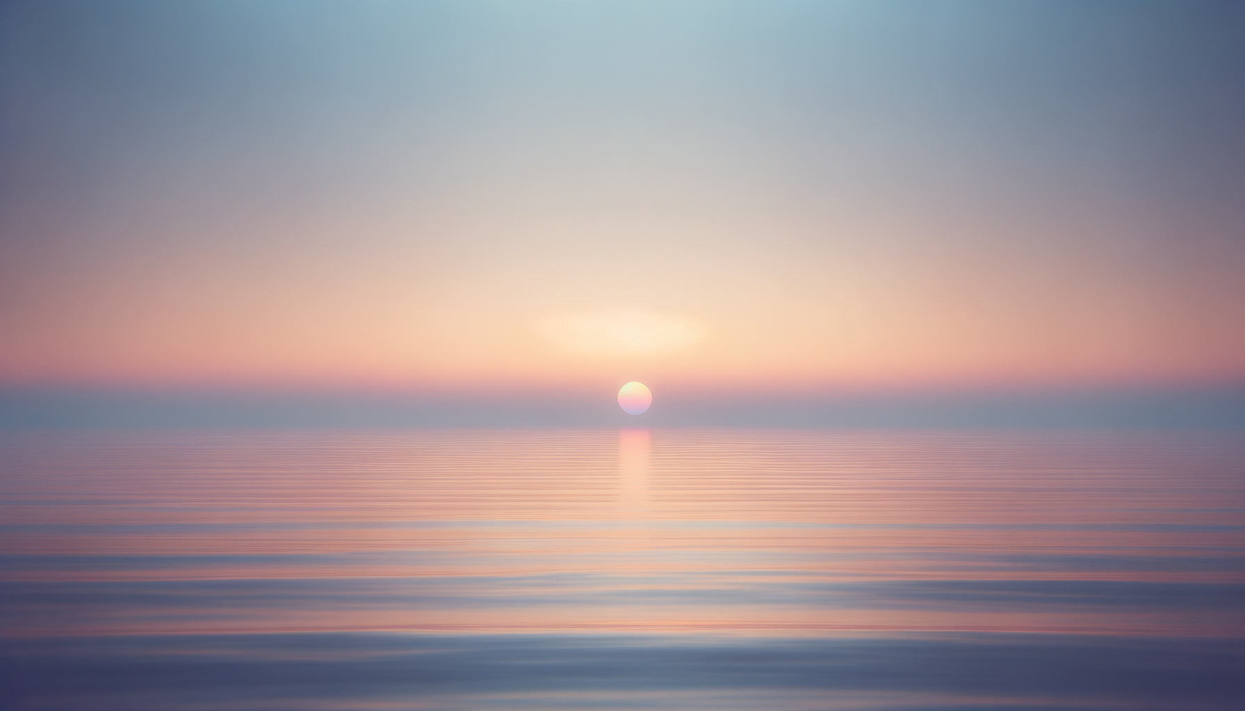 A calm ocean at sunset with a pastel-colored sky and the sun near the horizon, casting a reflection on the water.