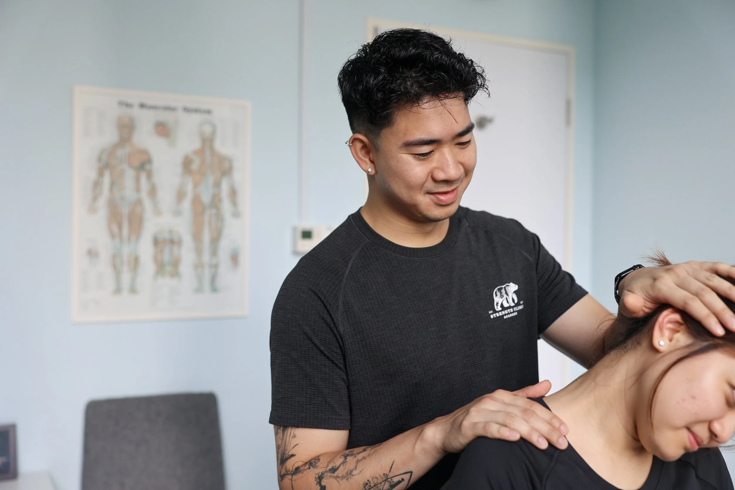 Physiotherapist treating neck pain at Strength Clinic Academy Singapore