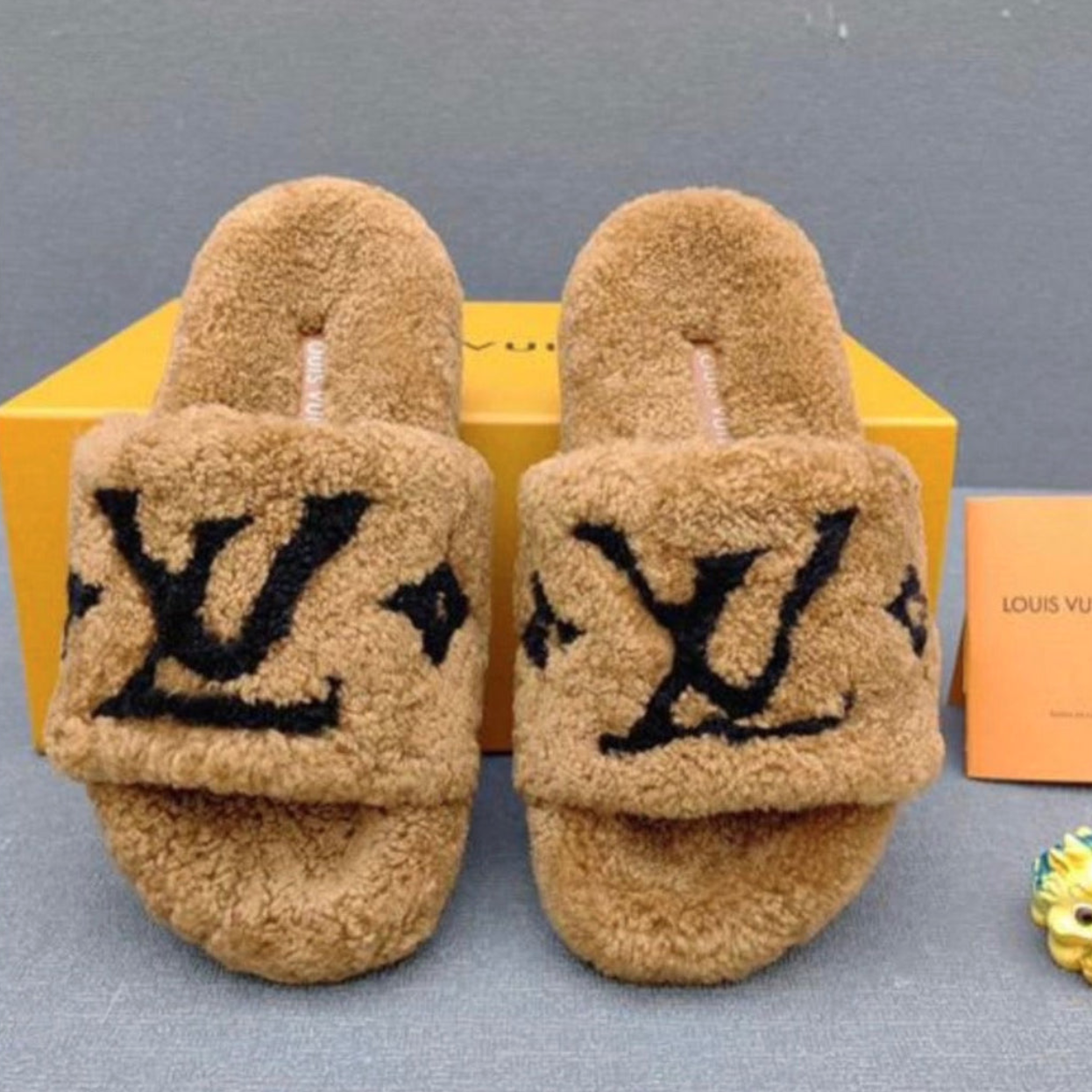 THE PLUSH ICON SLIPPER - $55