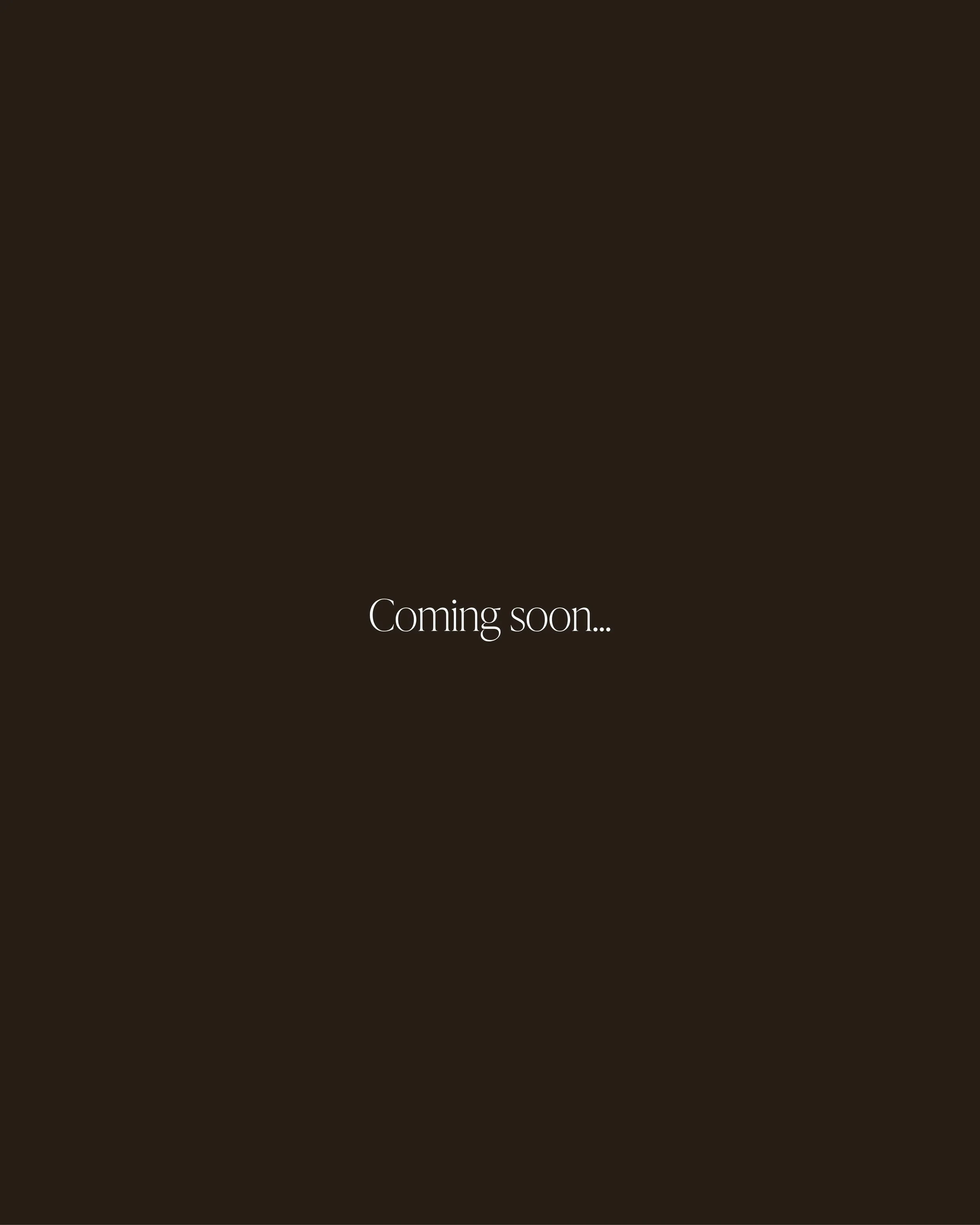 A dark background with the words 'Coming soon...' centered in white.