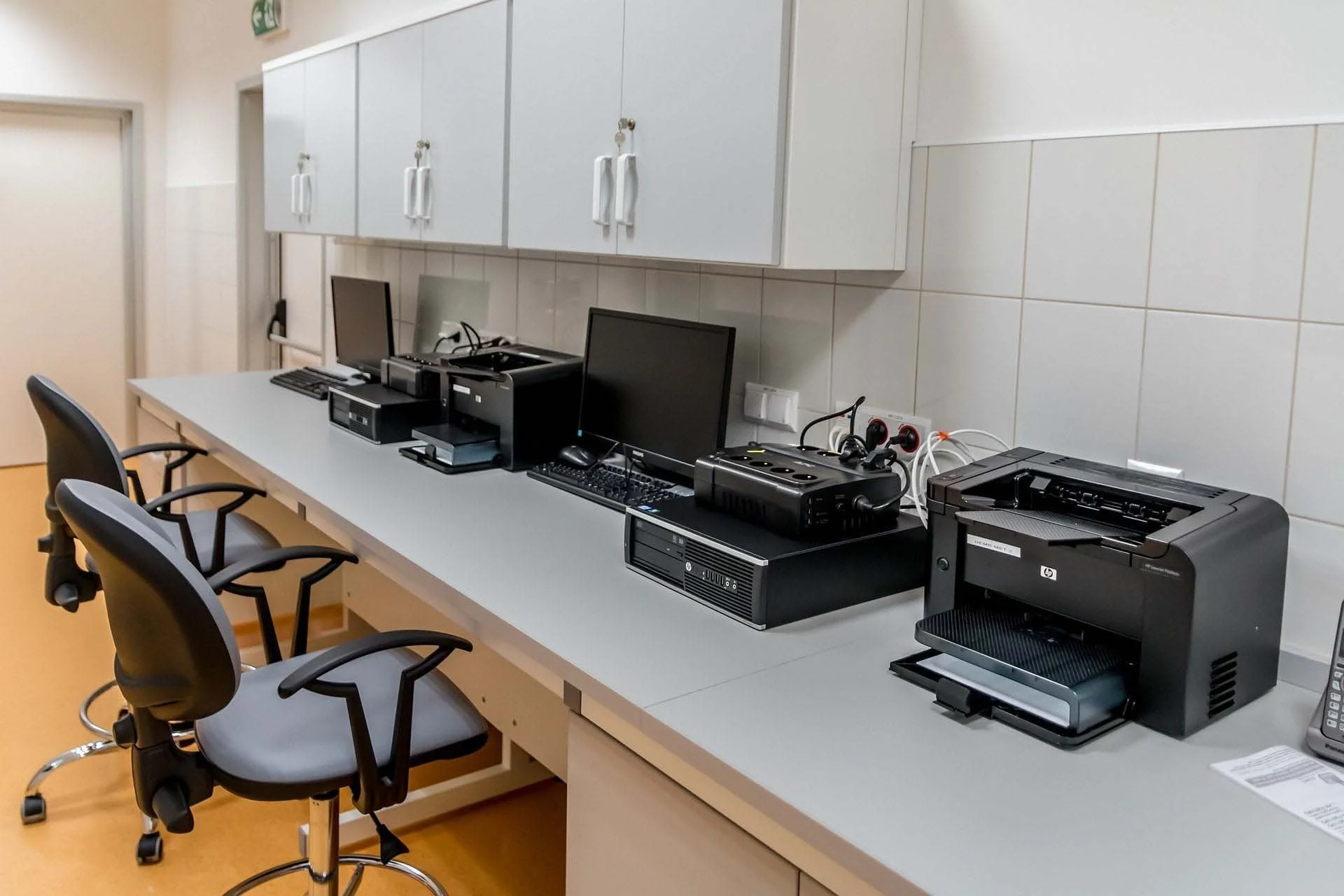 Workspace with 2 computers and a printer