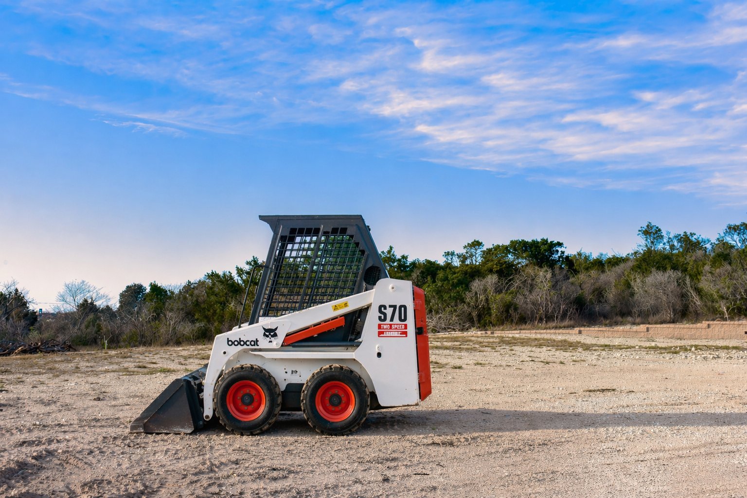 Bobcat skid-steer loader in open lot.png