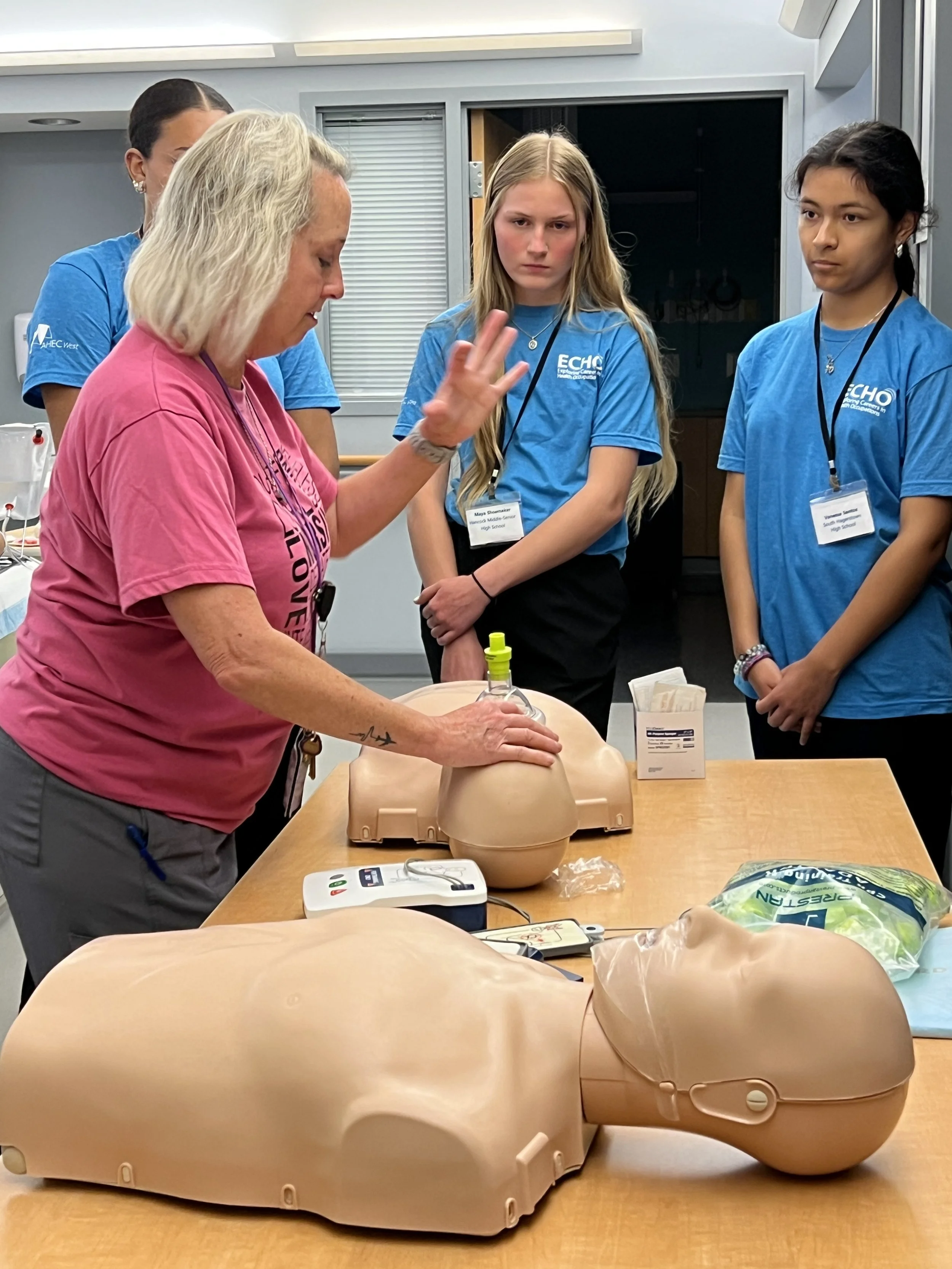 ECHO students practicing CPR technique