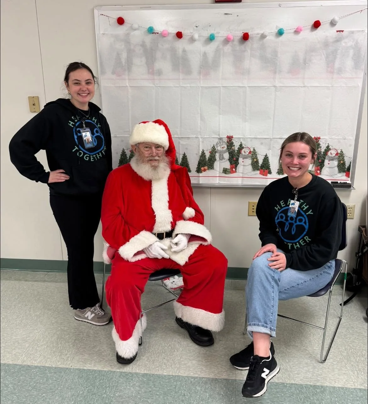 Healthy Together team with Santa at community event