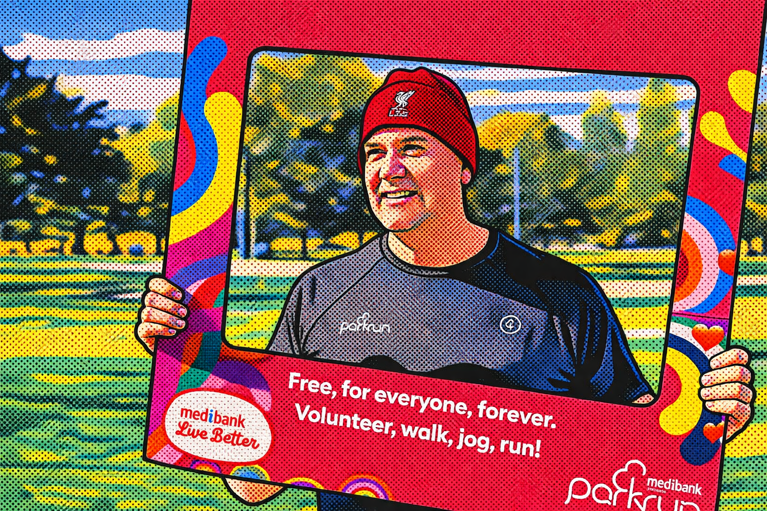 A woman holding a colorful sign promoting free outdoor activities like walking, jogging, and running. She is outdoors with trees and a sports field in the background. The sign features the Medibank logo and the words 'Live Better' and 'Free, for everyone, forever. Volunteer, walk, jog, run!'.