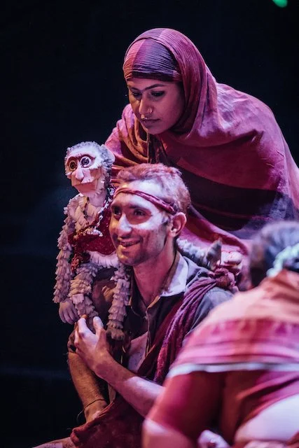 A scene from A Fine Balance with a monkey puppet by Paul Lewis