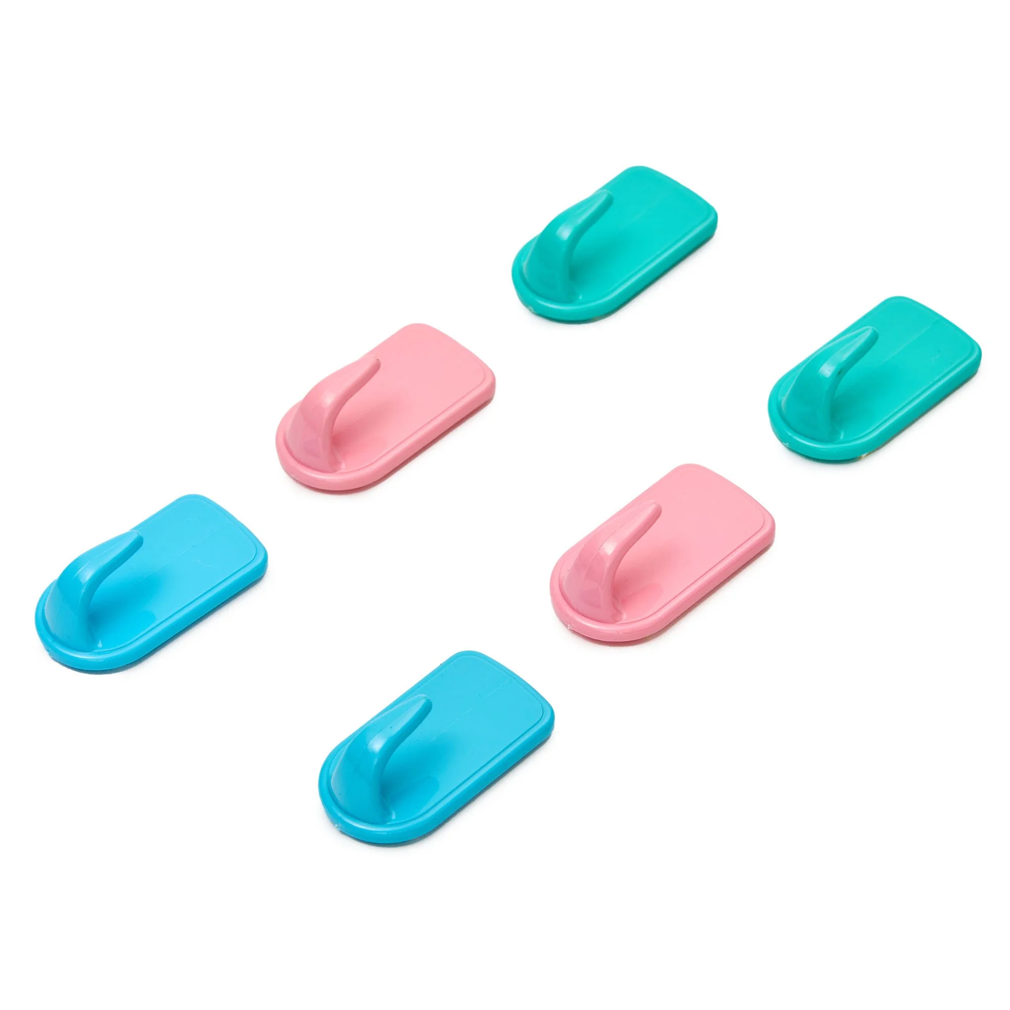 Colorful plastic clips arranged in a pattern on a white background.