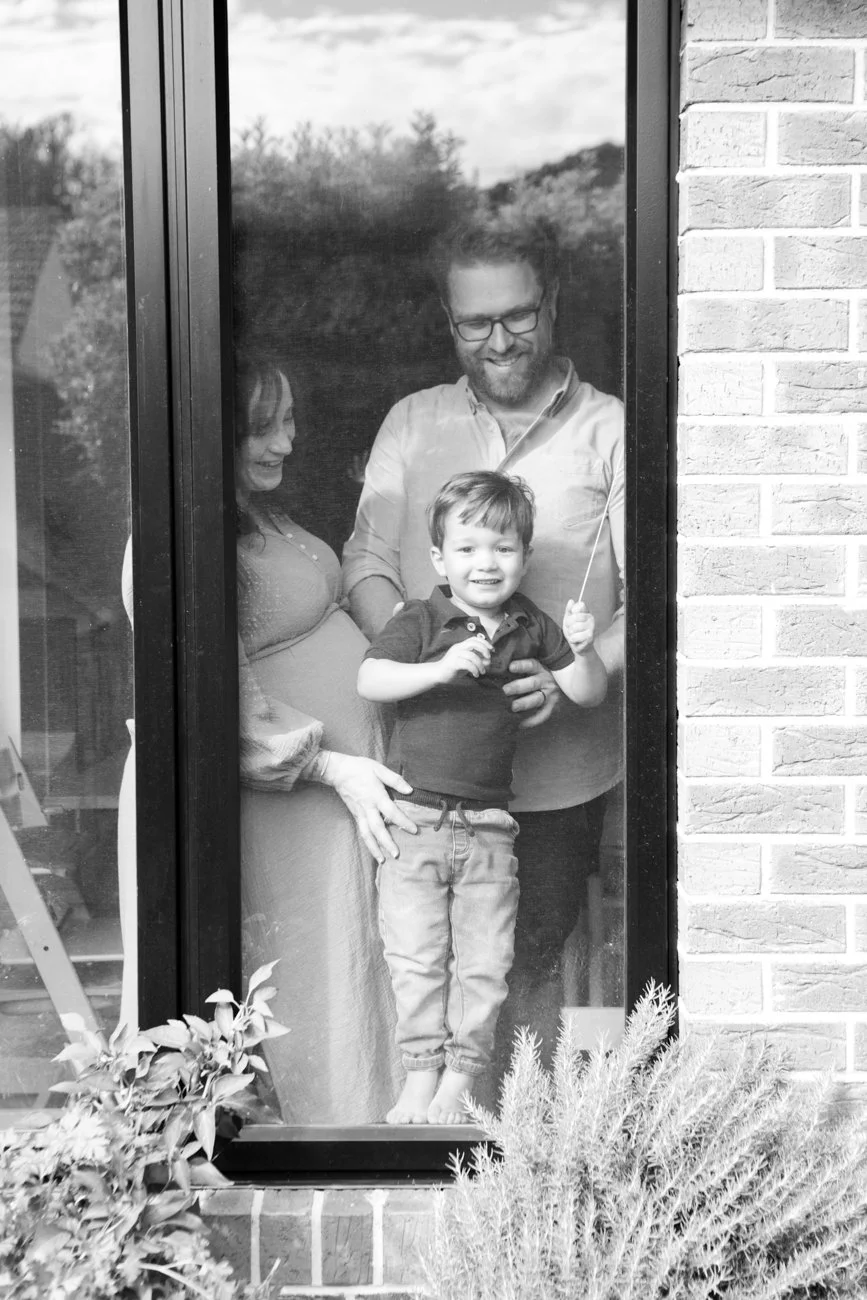 family-portraiture-family-in-window.001.jpg
