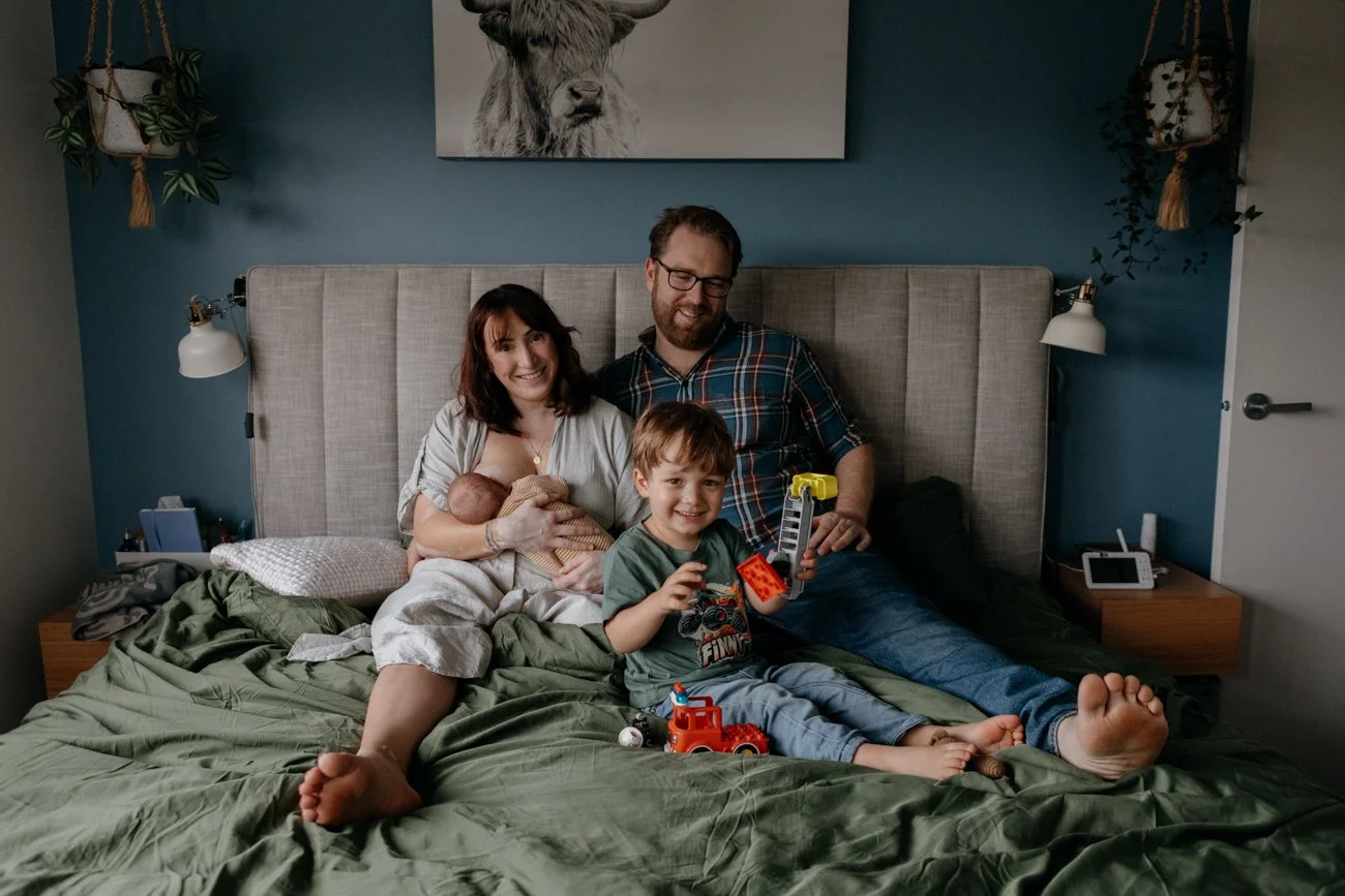 family-portraiture-family-resting-on-bed.002.jpg