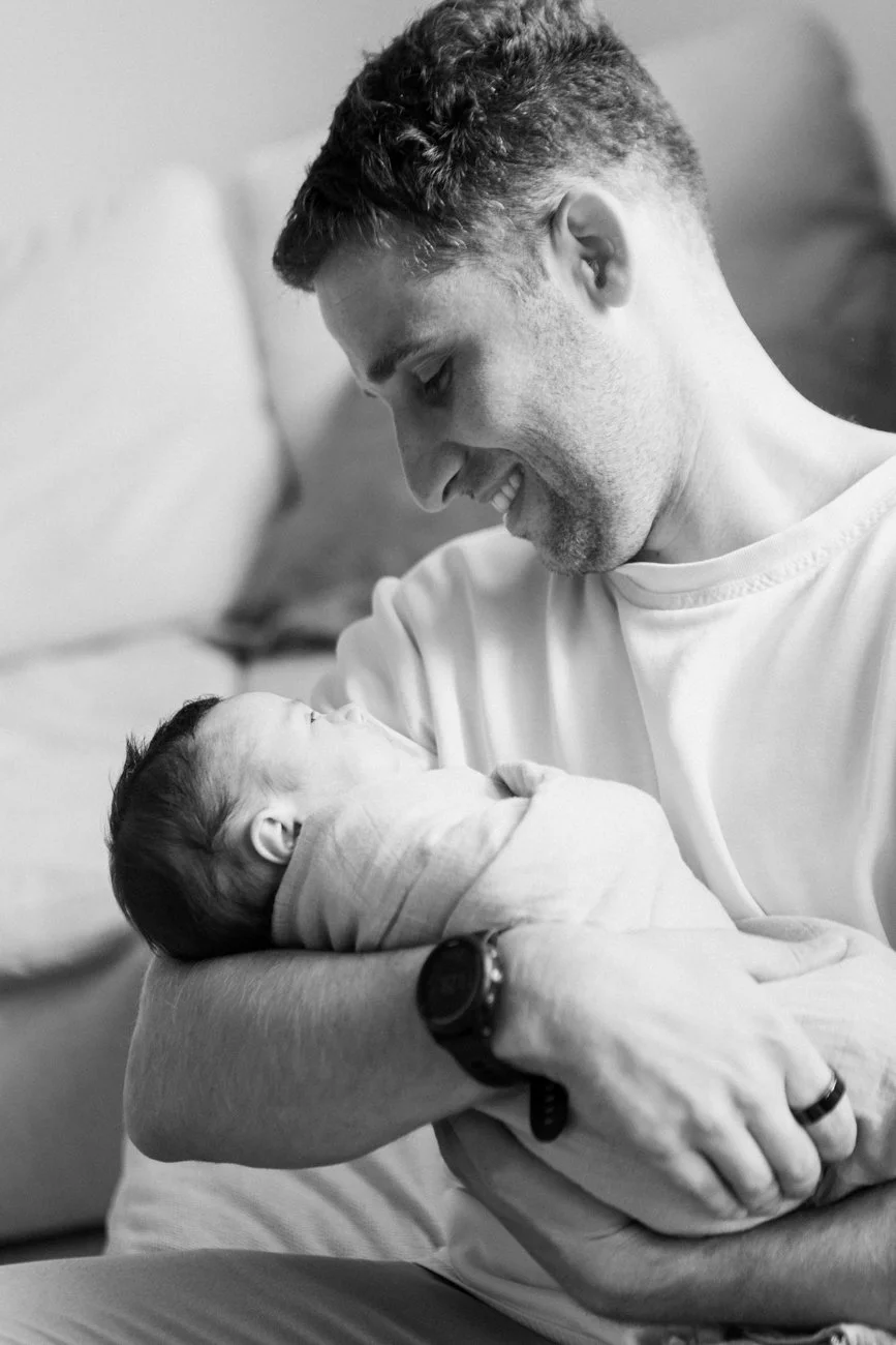 family-portraiture-father-holding-newborn.001.jpg