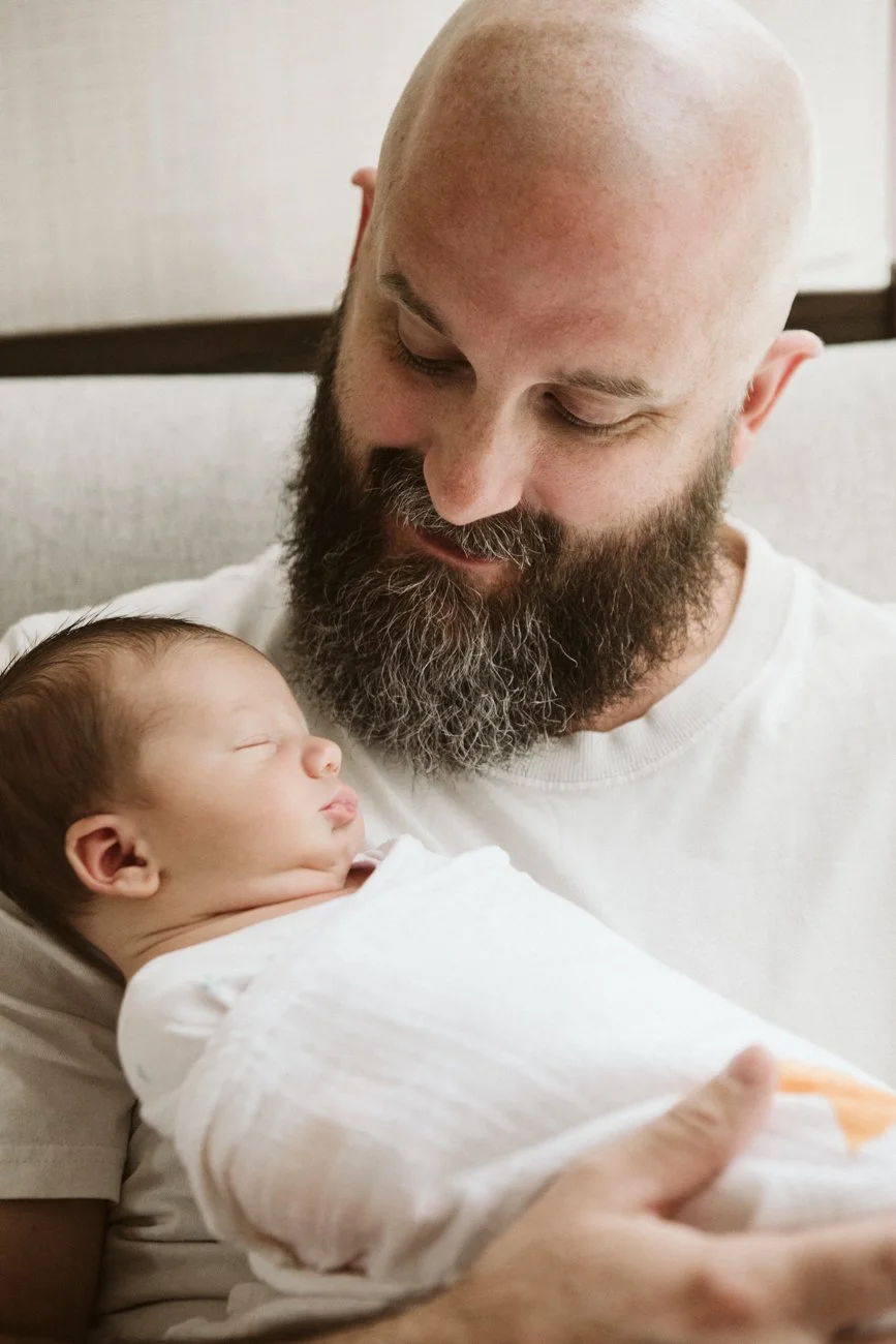 family-portraiture-father-cradling-newborn.001.jpg