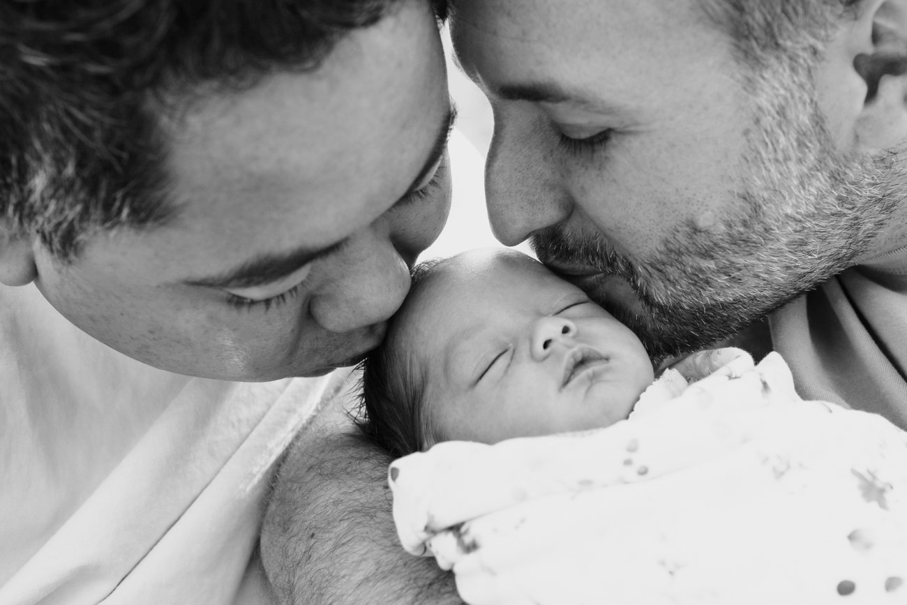 family-portraiture-fathers-kissing-newborn.001.jpg