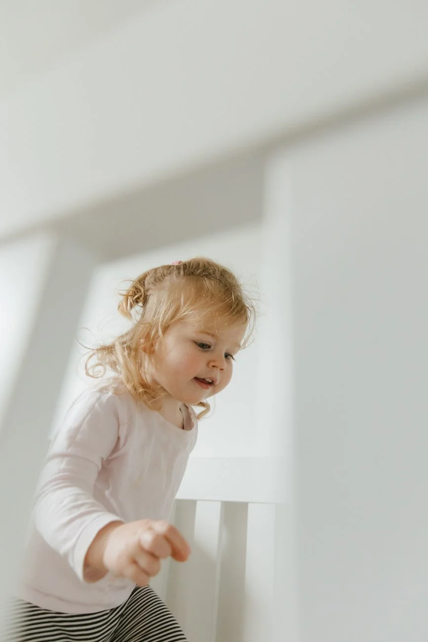 family-portraiture-child-in-cot.003.jpg
