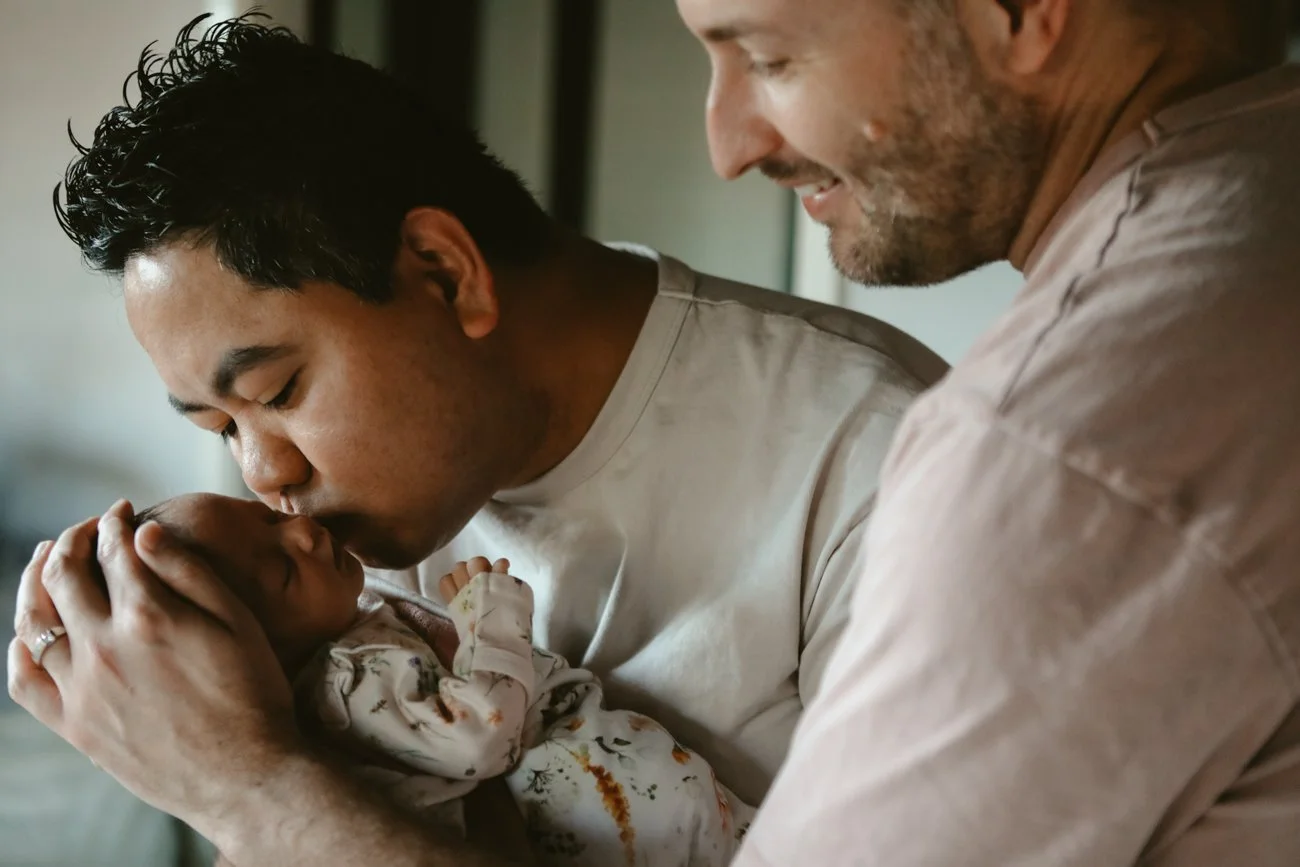 family-portraiture-father-kissing-newborn.002.jpg