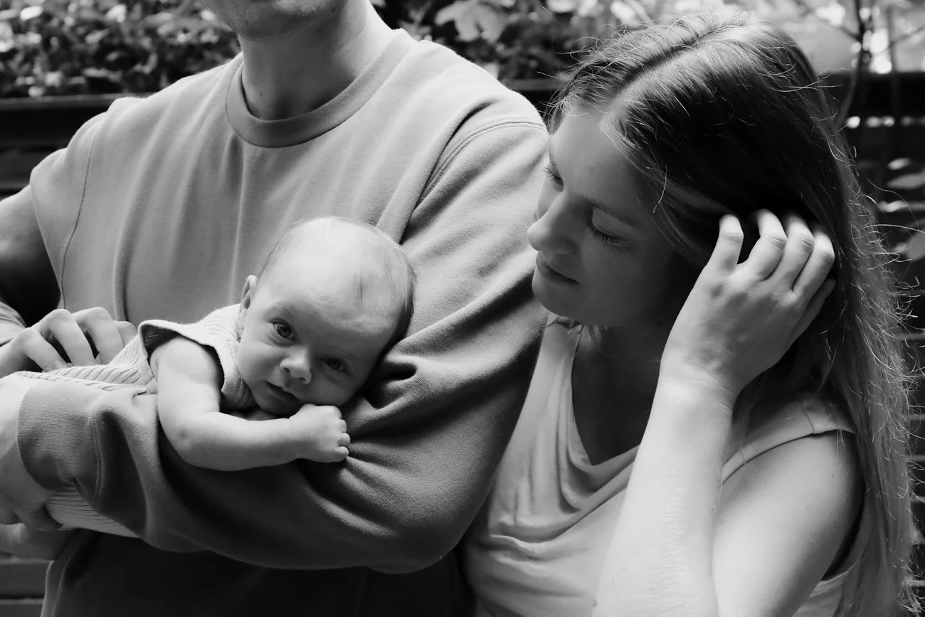 family-portraiture-mother-looking-at-newborn.001.jpg