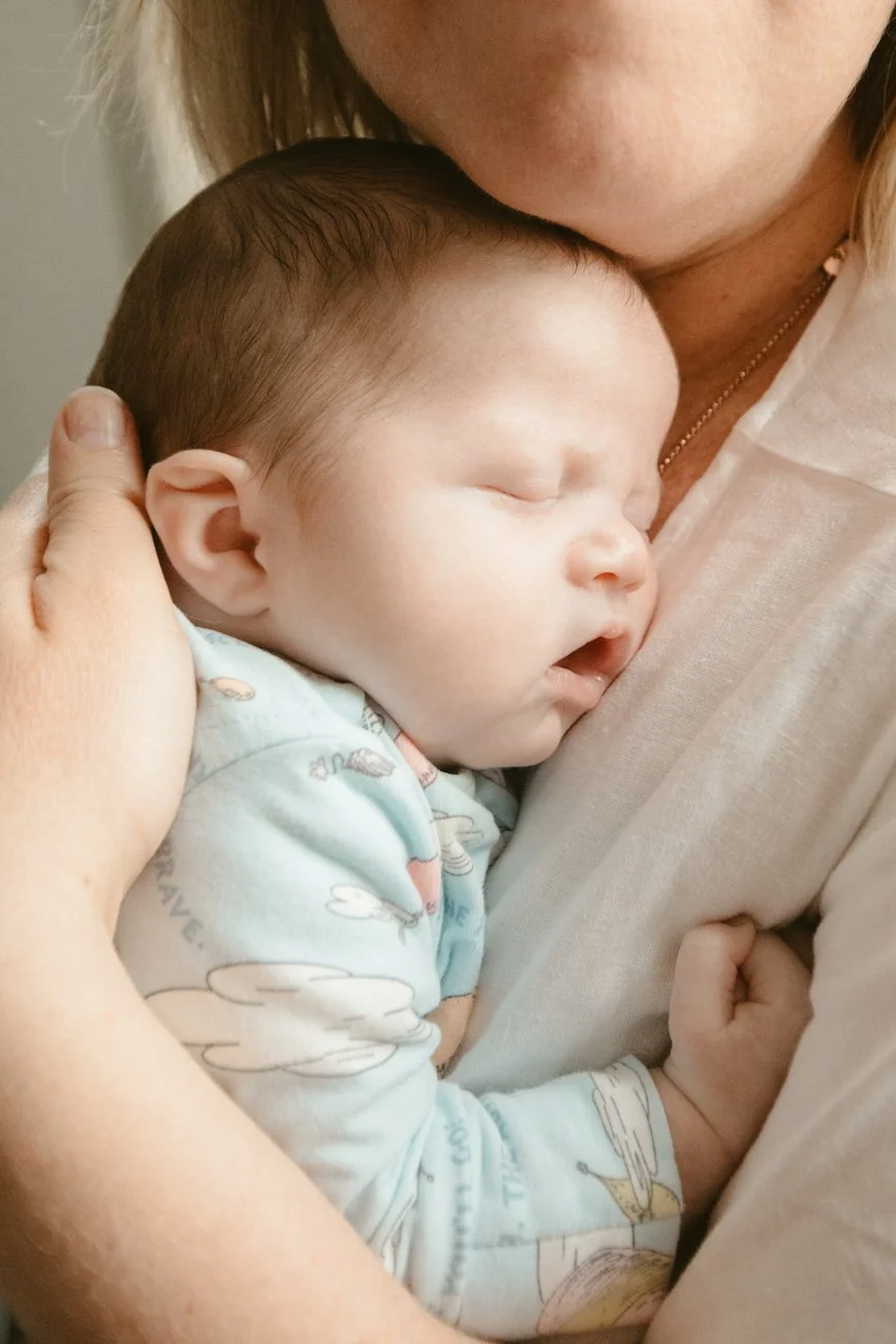 family-portraiture-mother-embracing-newborn.001.jpg