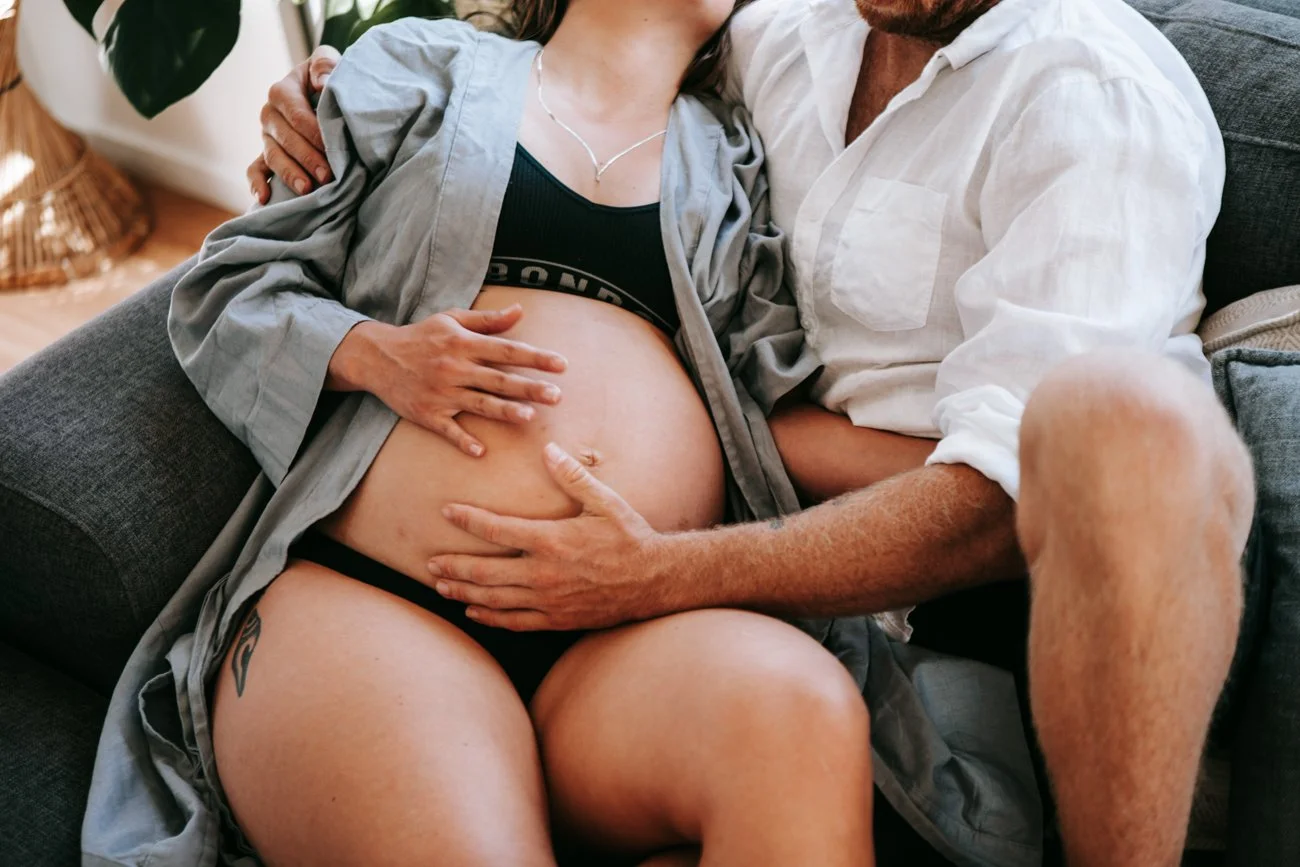 family-portraiture-couple-holding-belly.003.jpg