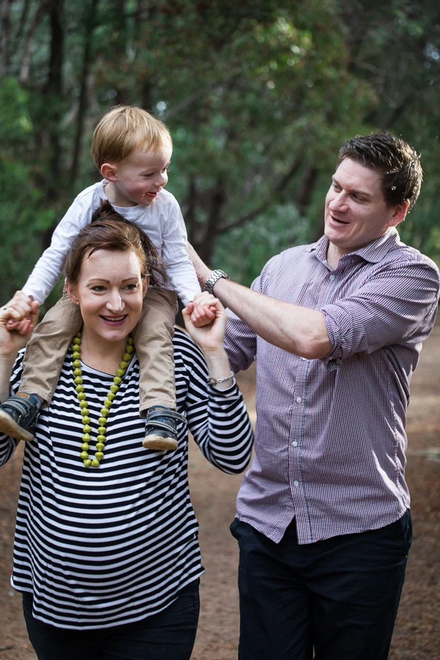 family-portraiture-father-mother-with-son-on-shoulders.001.jpg