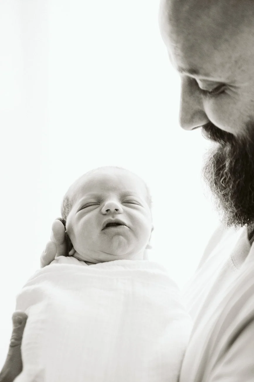 family-portraiture-father-cradling-newborn.002.jpg