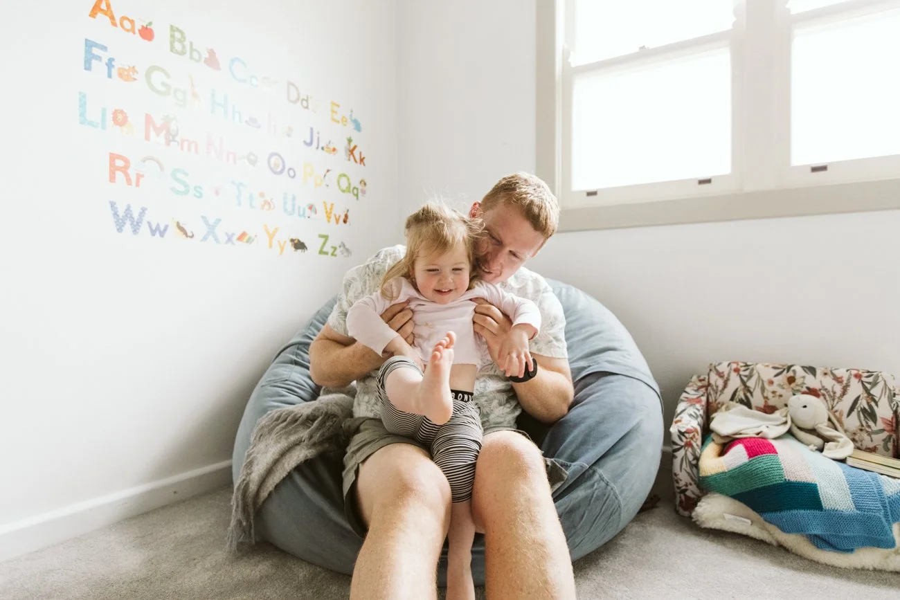family-portraiture-father-cuddling-daughter.001.jpg