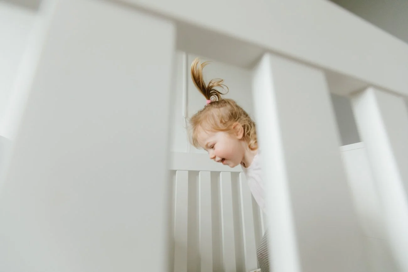 family-portraiture-child-in-cot.002.jpg