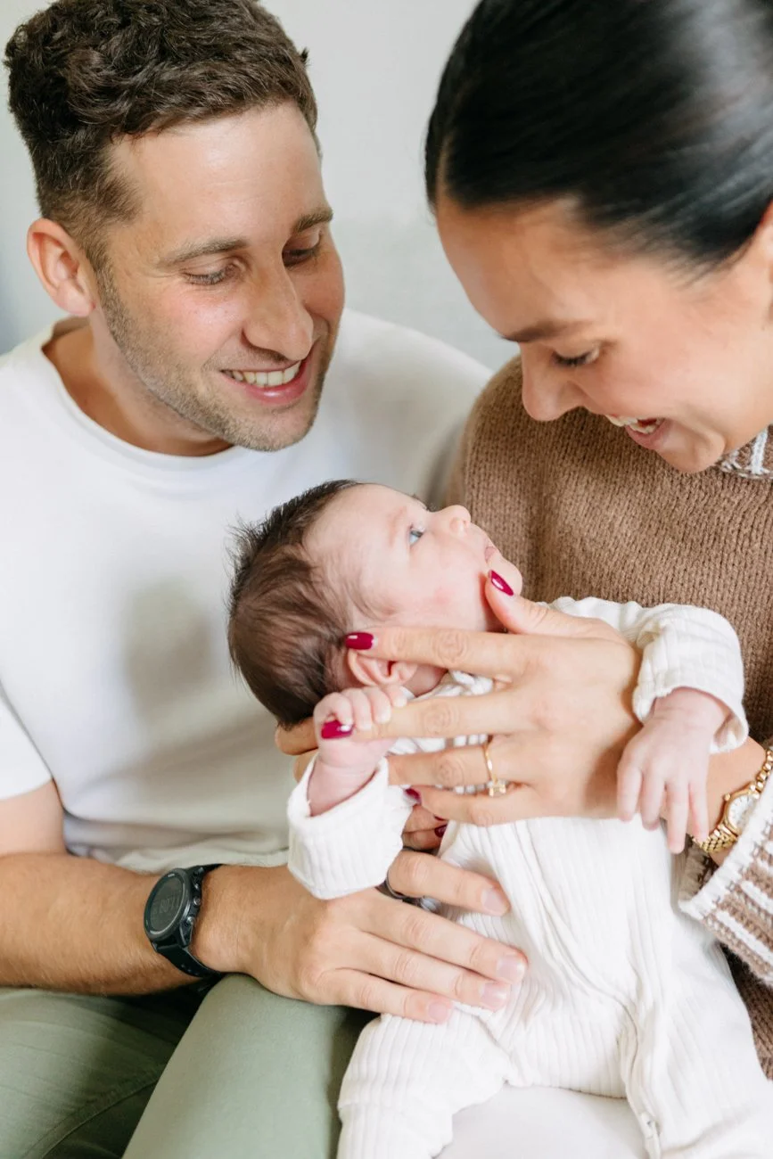 family-portraiture-newborn-looking-up-at-mothers.001.jpg
