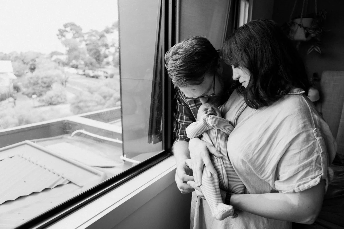 family-portraiture-father-mother-newborn-window.001.jpg