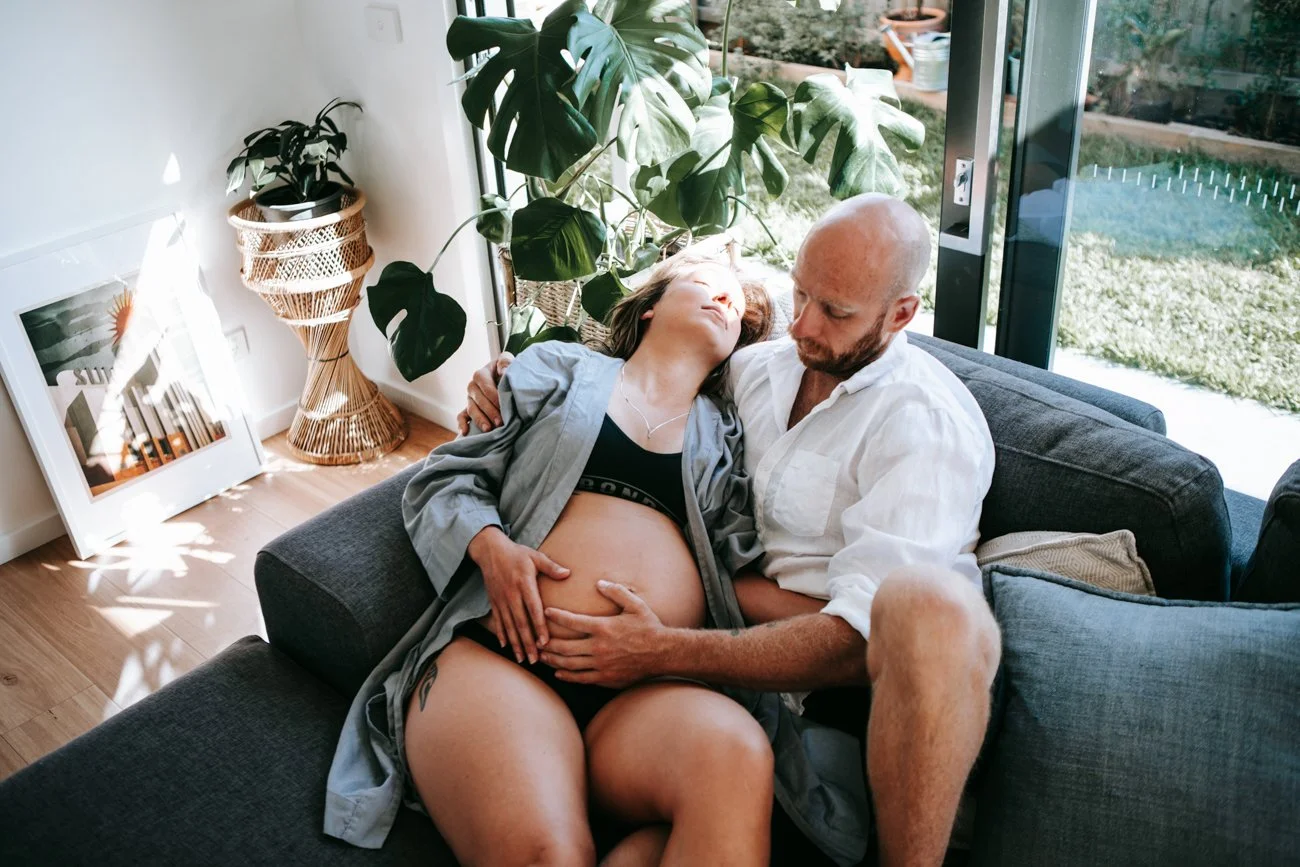 family-portraiture-couple-holding-belly.002.jpg